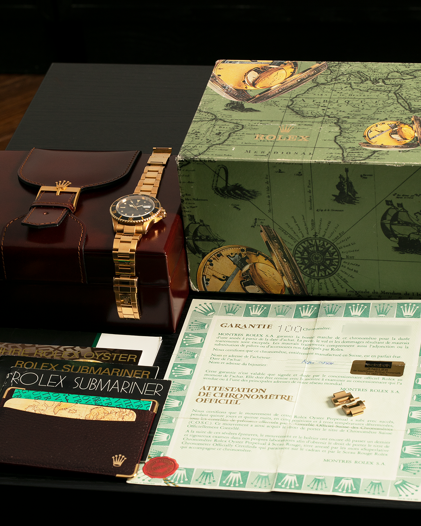 Brand: Rolex
Year: 1984
Model: Submariner
Reference Number: 16808
Serial Number: 838XXXX
Material: 18-carat Yellow Gold
Movement: Rolex Cal. 3035, Self-Winding
Case Dimensions: 40mm x 12.5mm (Lug-to-Lug 47.5mm)
Lug Width: 20mm
Bracelet: Rolex 92908 Oyster Bracelet in 18-carat Yellow Gold With Signed Deployant Clasp with Dive Extension