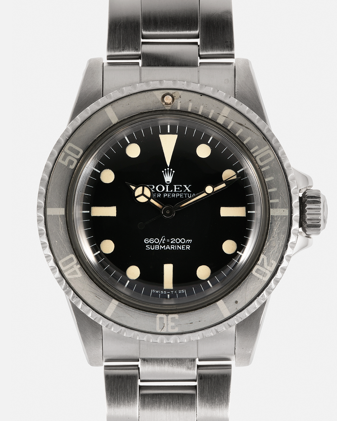 Brand: Rolex Year: 1977 Model: Submariner Reference Number: 5513 Serial Number: 5276XXX Material: Stainless Steel Movement: Rolex Cal. 1520, Self-Winding Case Diameter: 40mm x 14.8mm (with Domed Crystal) (Lug-to-Lug 47mm) Lug Width: 20mm Bracelet: Rolex Stainless Steel ‘93150’ Oyster Bracelet with ‘580’ End Links and ‘VB’ Marked Clasp