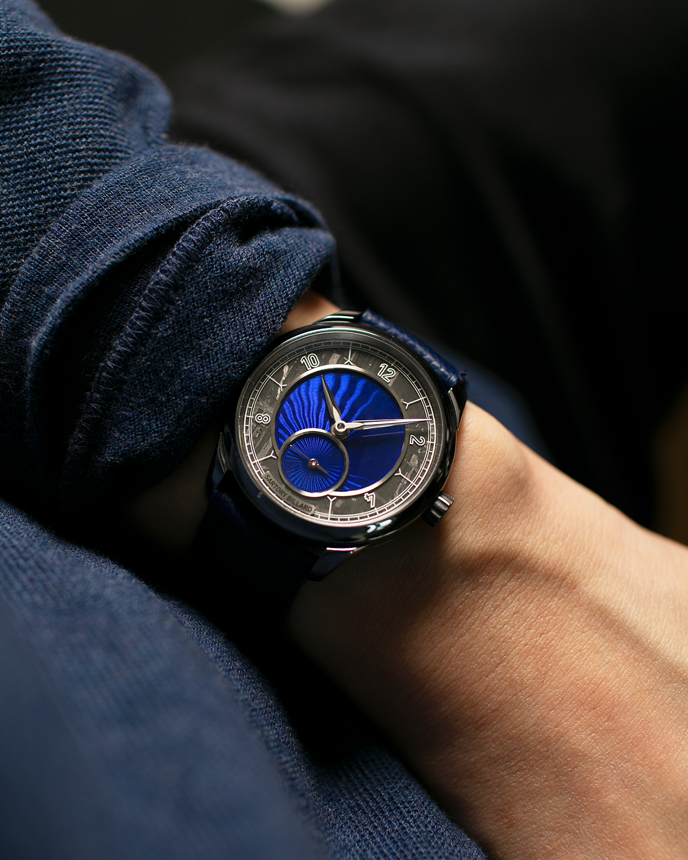 Brand: Sartory Billard Year: 2023 Model: SB05 Material: Tantalum Case, Meteorite Chapter Ring Movement: La Joux-Perret Cal. 7380, Manual-Winding  Case Diameter: 38.5mm Strap: Sartory Billard Dark Blue Textured Calf Leather Strap with Sartory Billard Signature Tang Buckle, with an additional Sartory Billard Veal Hermeline Strap and a Calf Suede Strap, both additional straps with Sartory Billard Signature Tang Buckles