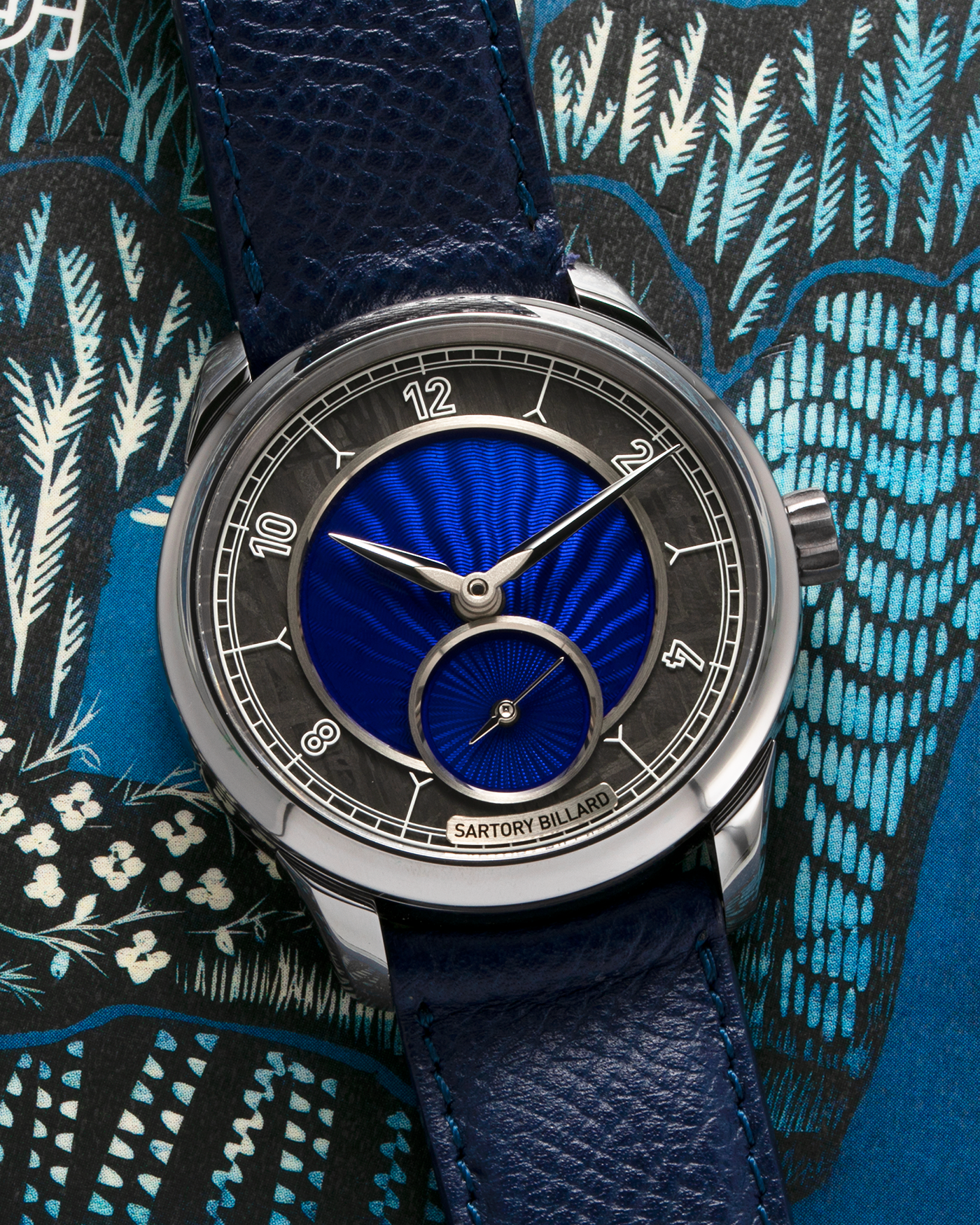 Brand: Sartory Billard Year: 2023 Model: SB05 Material: Tantalum Case, Meteorite Chapter Ring Movement: La Joux-Perret Cal. 7380, Manual-Winding  Case Diameter: 38.5mm Strap: Sartory Billard Dark Blue Textured Calf Leather Strap with Sartory Billard Signature Tang Buckle, with an additional Sartory Billard Veal Hermeline Strap and a Calf Suede Strap, both additional straps with Sartory Billard Signature Tang Buckles