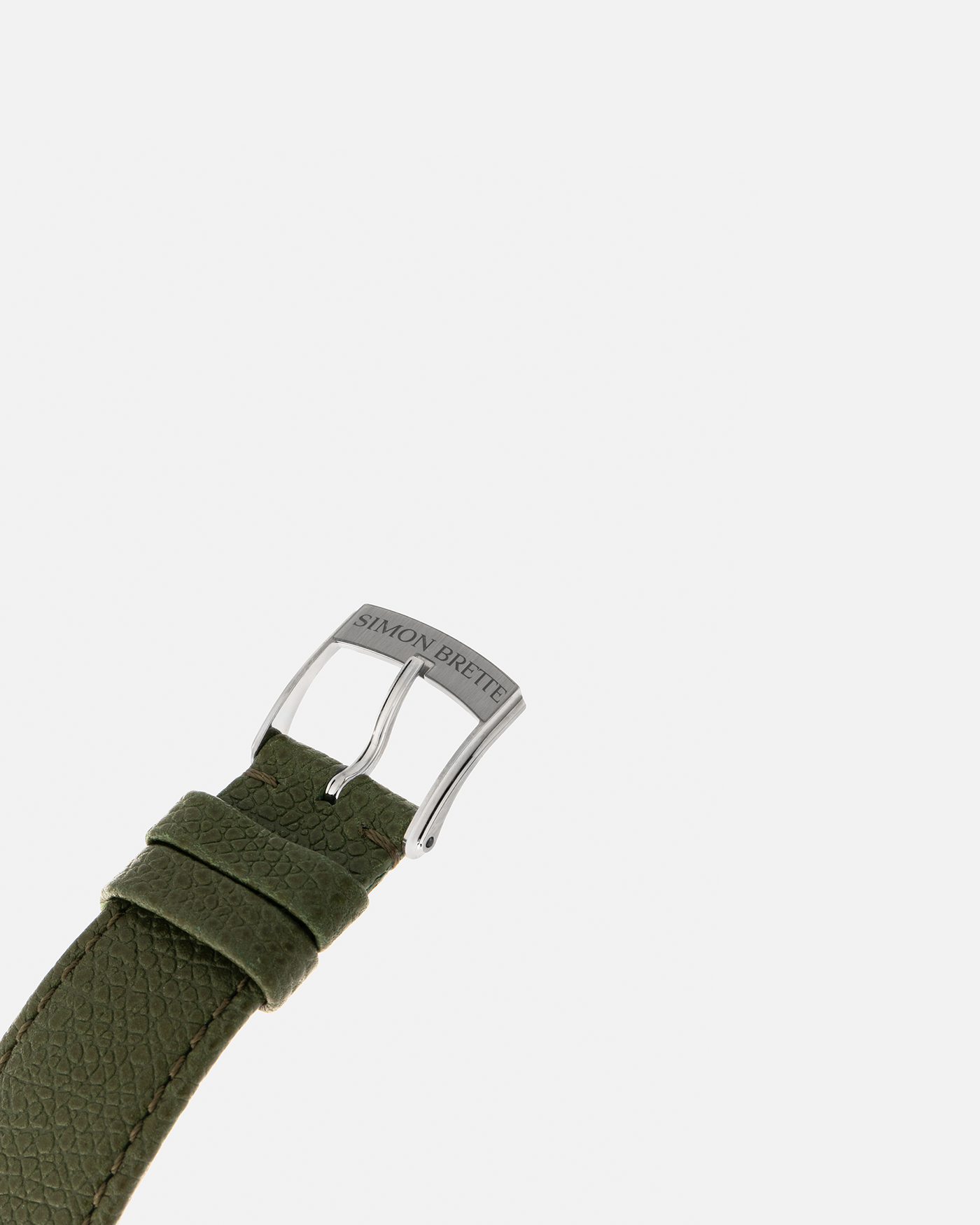 Brand: Simon Brette
Year: 2025
Model: Chronometre Artisans
Reference Number: 64.237.XXX
Material: Grade 5 Titanium
Movement: Simon Brette In-House, Manually Wound Cal. SBCA
Case Dimensions: 39mm Diameter 10.5mm Thickness
Lug Width: 20mm
Strap: Simon Brette Green Calf Leather Strap with Signed Grade 5 Titanium Tang Buckle