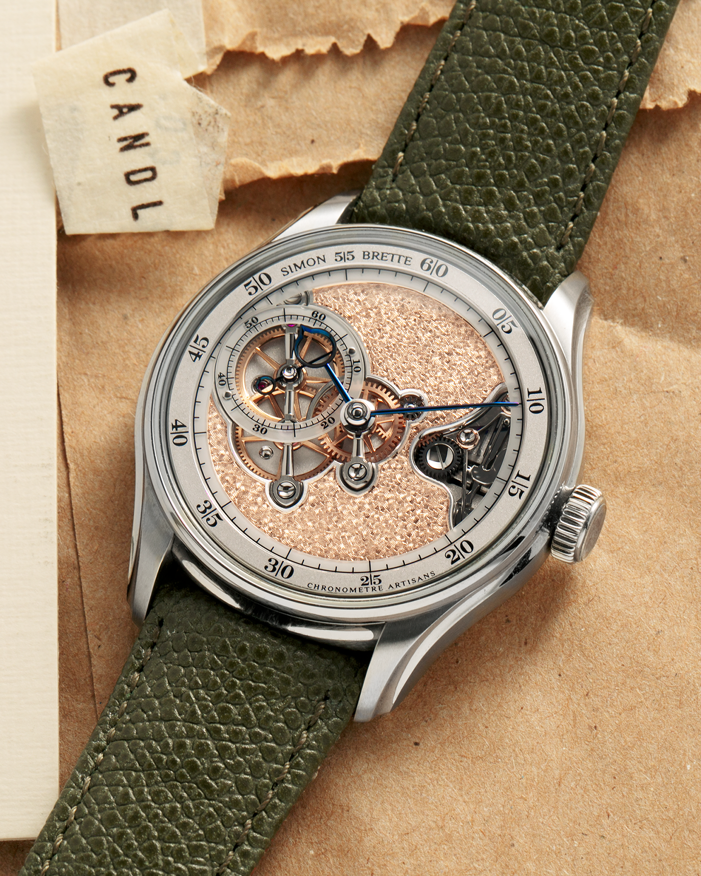 Brand: Simon Brette
Year: 2025
Model: Chronometre Artisans
Reference Number: 64.237.XXX
Material: Grade 5 Titanium
Movement: Simon Brette In-House, Manually Wound Cal. SBCA
Case Dimensions: 39mm Diameter 10.5mm Thickness
Lug Width: 20mm
Strap: Simon Brette Green Calf Leather Strap with Signed Grade 5 Titanium Tang Buckle