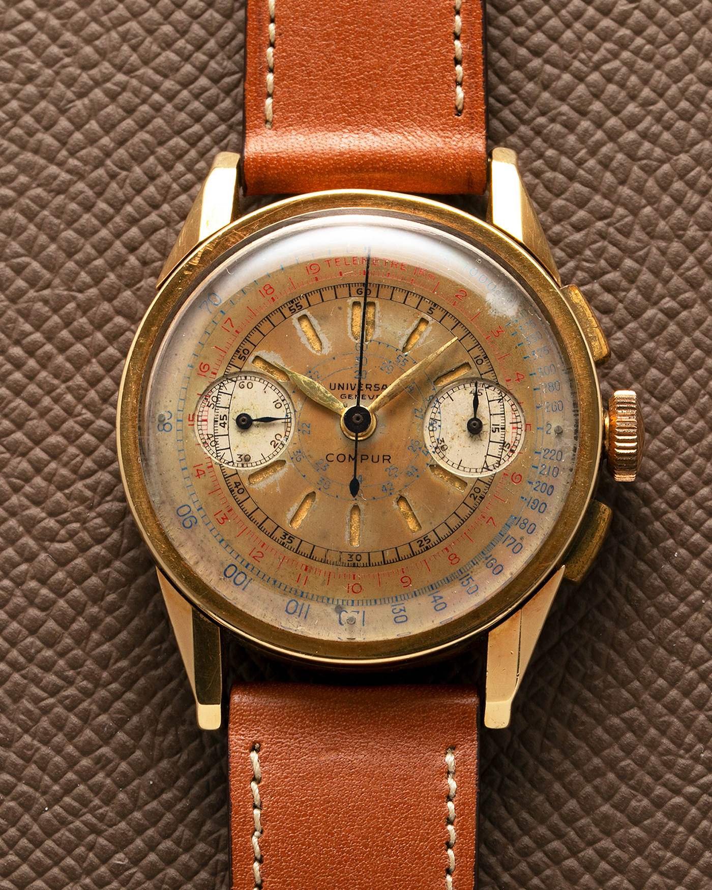 Brand: Universal Genève Year: 1930’s Model: Compur Reference Number: 5166 Case Maker: Stamped ‘Hammerhead 166’, by Henri Jeanneret in Peseux Case Number: 616378 Material: 18-carat Yellow Gold Movement: Universal Genève Cal. 285, Manual-Winding Case Diameter: 38mm Strap: Light Brown Nostime Calf Leather Strap