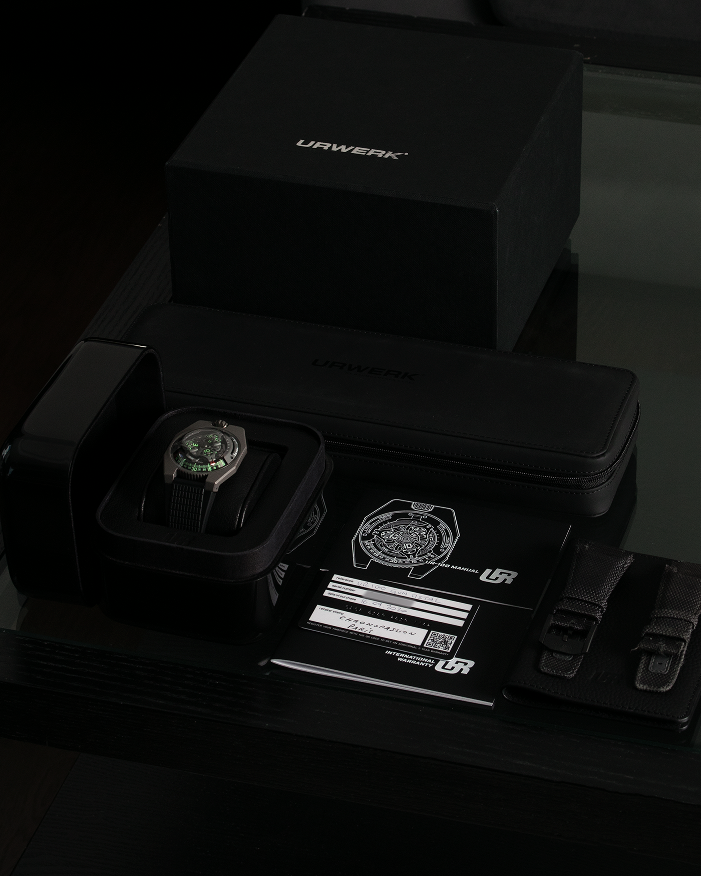 Brand: Urwerk Year: 2020 Model: UR100 GunMetal, Limited Edition of 25 Pieces Material: Titanium and Stainless-Steel Case with GunMetal PVD-Coating, ARCAP Alloy (Blend of Nickle, Copper, Cobalt and Zinc) Movement Carousell System Movement: Urwerk Cal. 12.01, Self-Winding Case Dimensions: 41mm x 14mm Strap: Urwerk Proprietary Black Rubber Strap with Signed Deployant Buckle, with additional Urwerk Proprietary Black Textile Strap