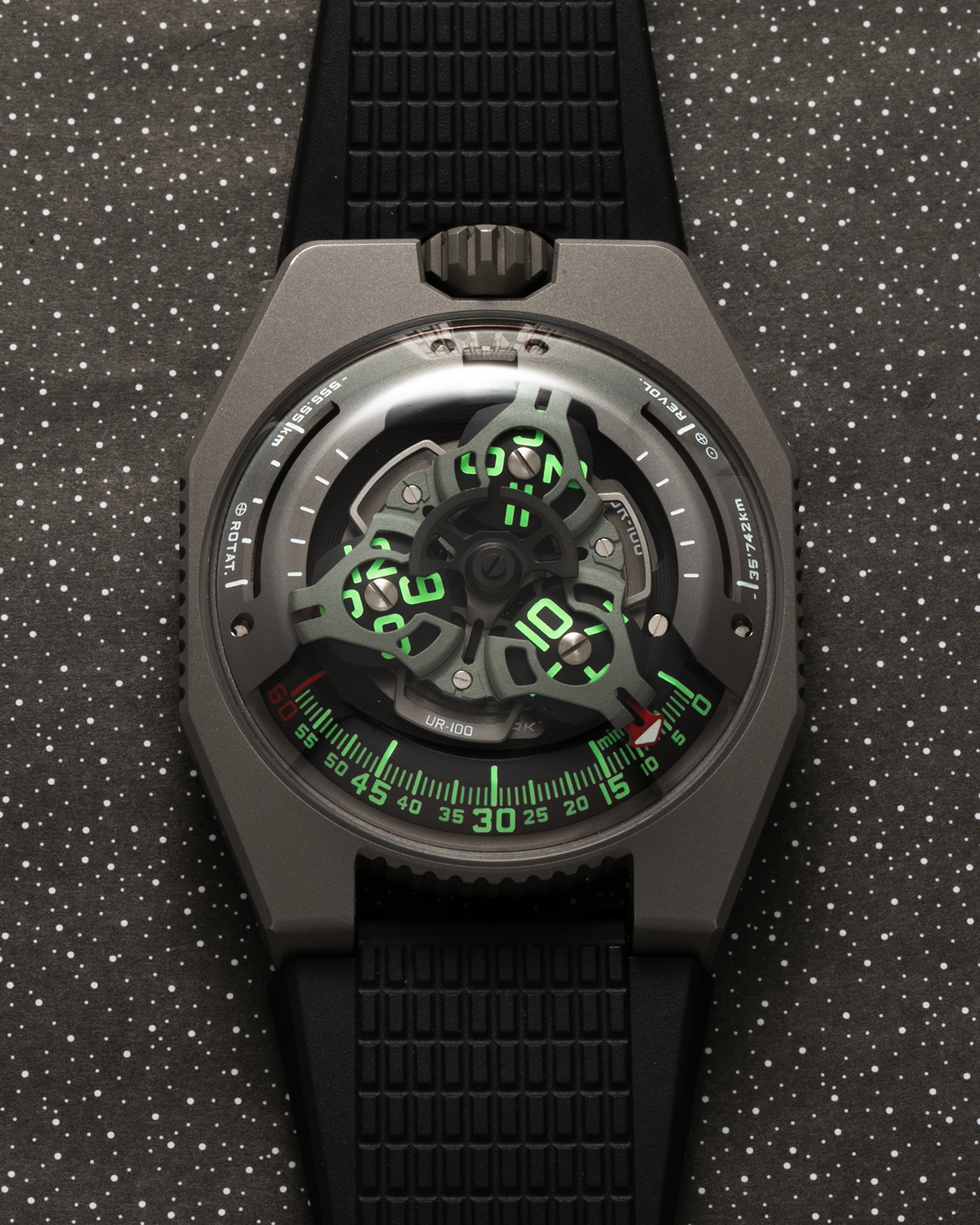 Brand: Urwerk Year: 2020 Model: UR100 GunMetal, Limited Edition of 25 Pieces Material: Titanium and Stainless-Steel Case with GunMetal PVD-Coating, ARCAP Alloy (Blend of Nickle, Copper, Cobalt and Zinc) Movement Carousell System Movement: Urwerk Cal. 12.01, Self-Winding Case Dimensions: 41mm x 14mm Strap: Urwerk Proprietary Black Rubber Strap with Signed Deployant Buckle, with additional Urwerk Proprietary Black Textile Strap