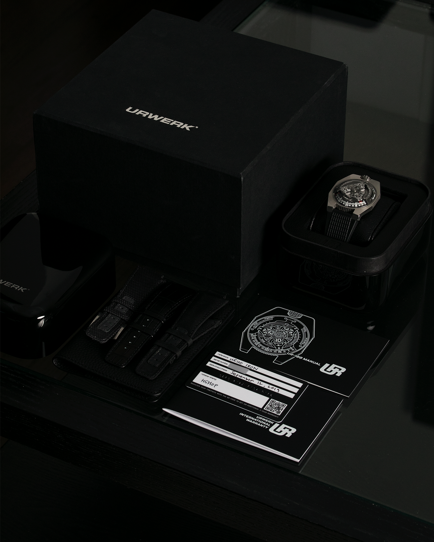 Brand: Urwerk Year: 2019 Model: UR100 Spacetime Iron, Limited Edition of 25 pieces Material: Stainless Steel Movement: Urwerk Cal. 12.01, Self-Winding Case Dimensions: 41mm x 14mm Bracelet/Strap: Urwerk Black Textured Rubber Strap with Signed Deployant Buckle, Additional Urwerk Black Textile Strap, Urwerk Grey Canvas Strap with Signed Stainless Steel Tang Buckle, and Urwerk Black Alligator Leather Strap.