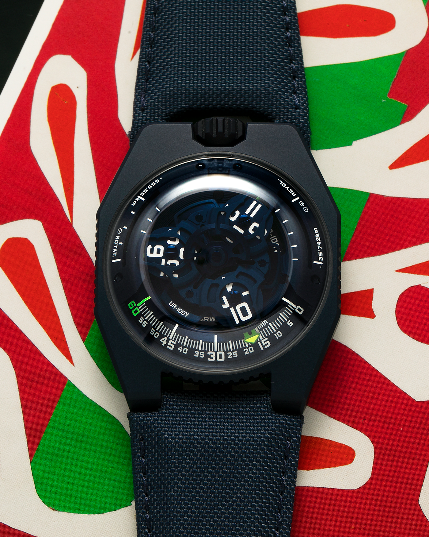 Brand: Urwerk Year: 2021 Model: UR100V Blue Planet, Limited Edition of 25 Pieces  Material: PVD-Coated Titanium Movement: Urwerk Cal. 12.01, Self-Winding Case Diameter: 41mm Strap: Urwerk Army Blue Textile Strap with Signed PVD-Coated Titanium Tang Buckle