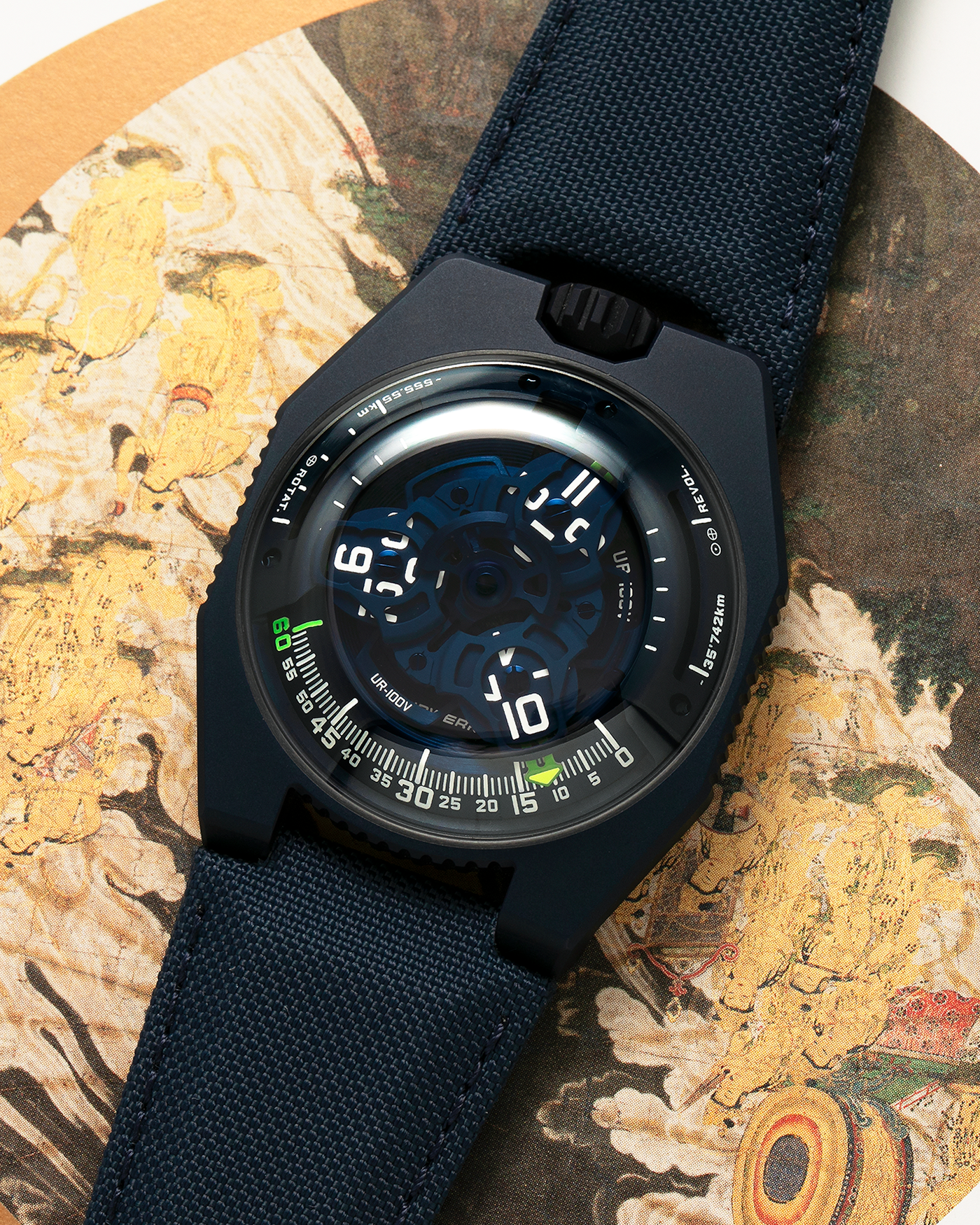 Brand: Urwerk Year: 2021 Model: UR100V Blue Planet, Limited Edition of 25 Pieces  Material: PVD-Coated Titanium Movement: Urwerk Cal. 12.01, Self-Winding Case Diameter: 41mm Strap: Urwerk Army Blue Textile Strap with Signed PVD-Coated Titanium Tang Buckle