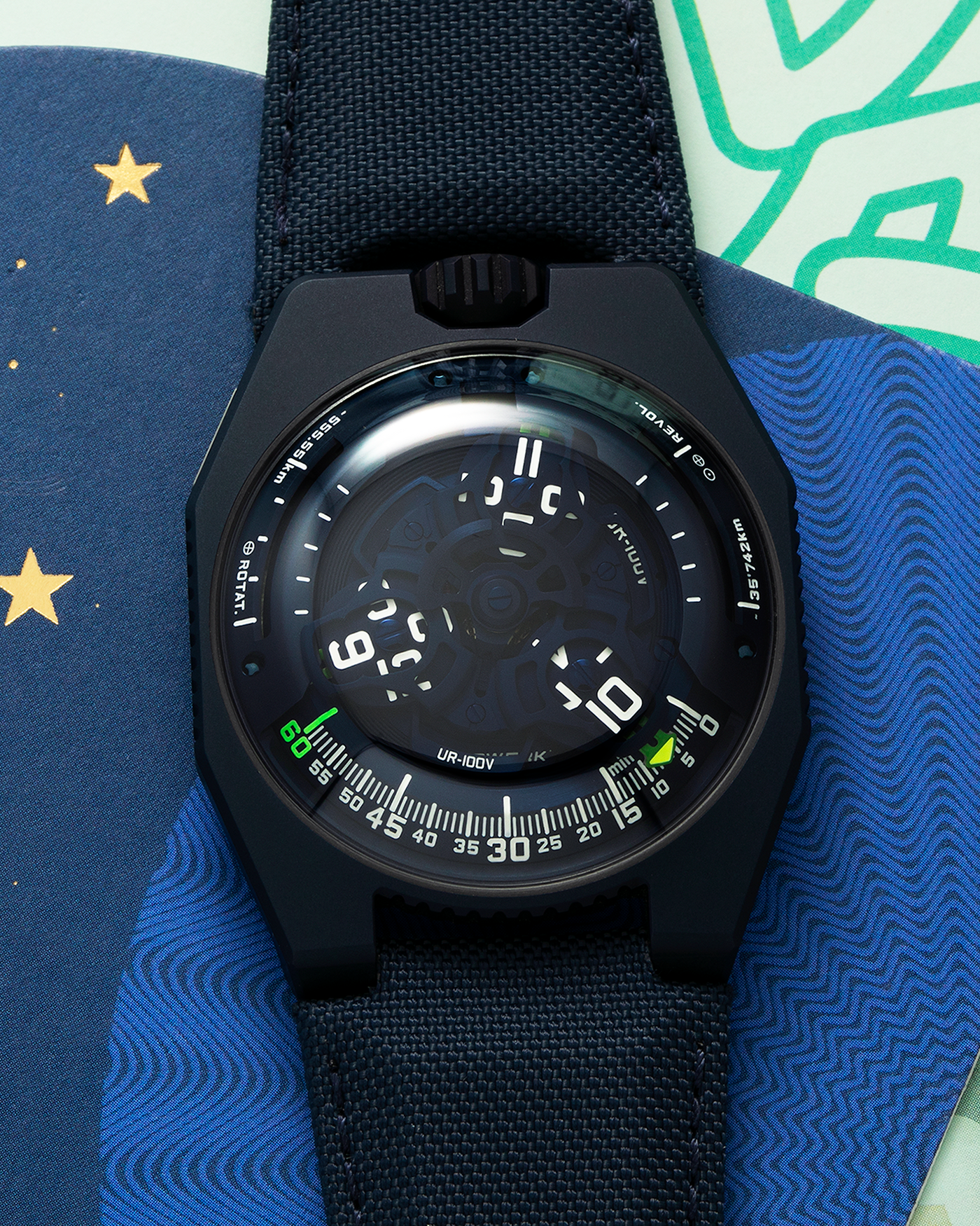 Brand: Urwerk Year: 2021 Model: UR100V Blue Planet, Limited Edition of 25 Pieces  Material: PVD-Coated Titanium Movement: Urwerk Cal. 12.01, Self-Winding Case Diameter: 41mm Strap: Urwerk Army Blue Textile Strap with Signed PVD-Coated Titanium Tang Buckle