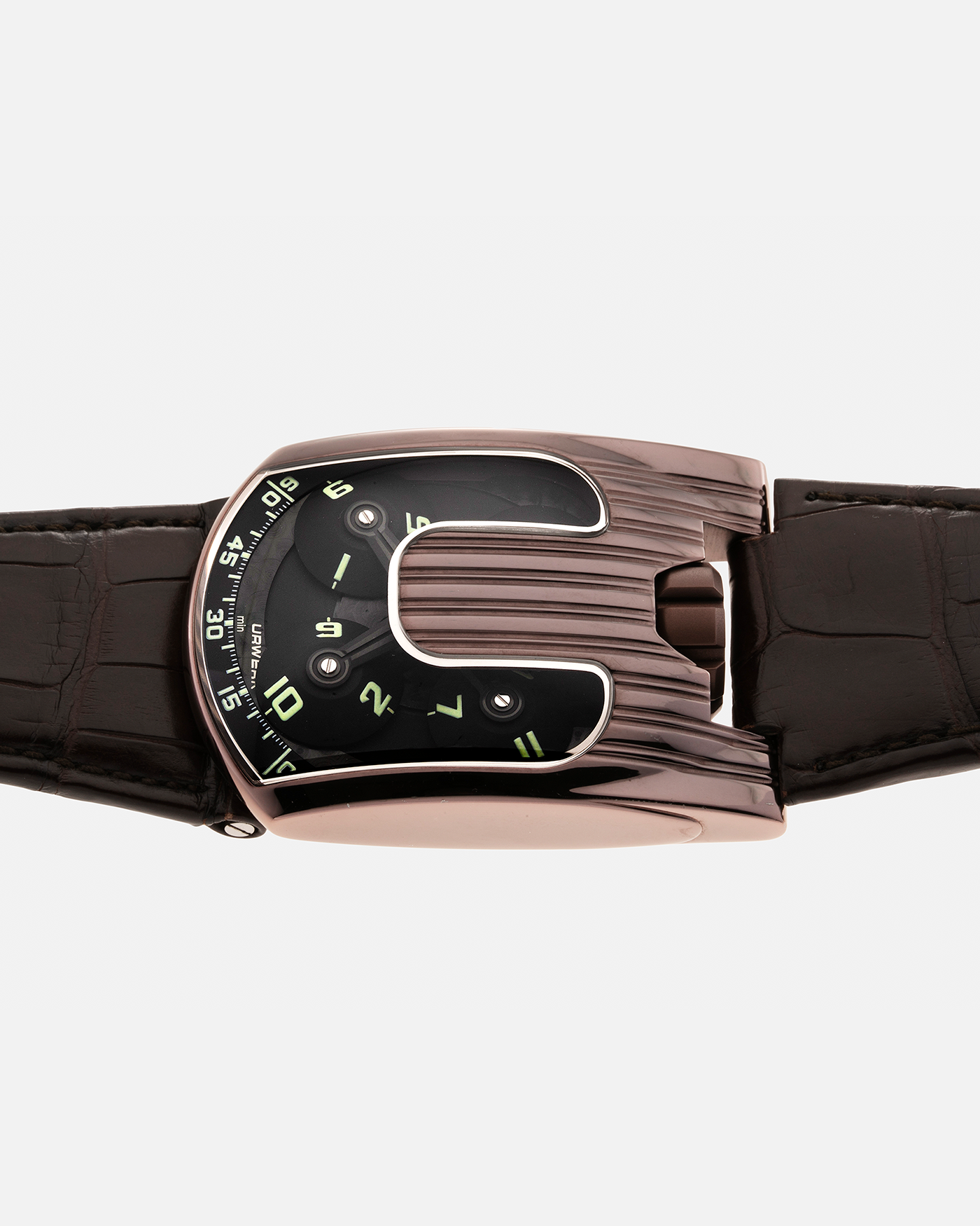 Brand: Urwerk Year: 2007 Model: UR103.08 TiAlN Material: Titanium Aluminium Nitride (TiAlN coated steel case) Movement: Urwerk Cal. 3.03, Manual-Winding Case Diameter: 50mm x 36mm Strap: Urwerk Dark Brown Alligator Leather Strap with signed TiAlN Tang buckle, with additional Urwerk Brown Alligator Leather Strap.