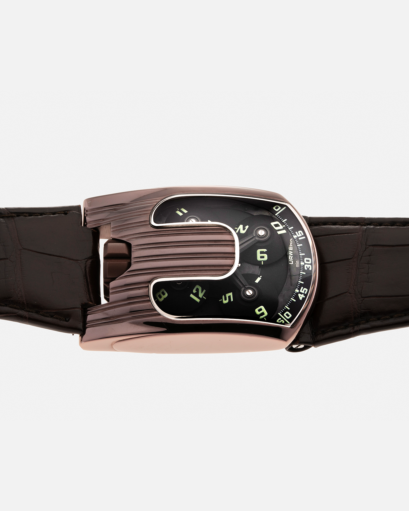 Brand: Urwerk Year: 2007 Model: UR103.08 TiAlN Material: Titanium Aluminium Nitride (TiAlN coated steel case) Movement: Urwerk Cal. 3.03, Manual-Winding Case Diameter: 50mm x 36mm Strap: Urwerk Dark Brown Alligator Leather Strap with signed TiAlN Tang buckle, with additional Urwerk Brown Alligator Leather Strap.