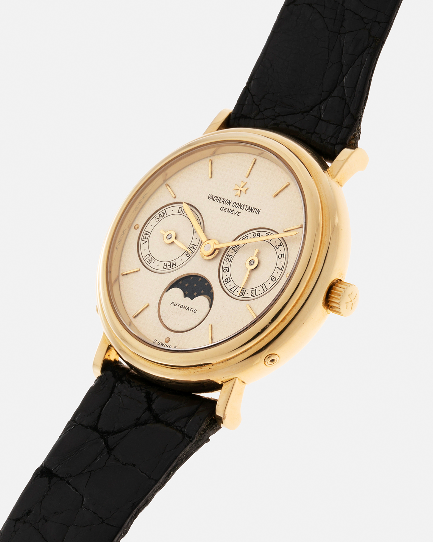 Brand: Vacheron Constantin Year: 1990’s Model: Day-Date Moonphase Reference Number: 46009 Material: 18-carat Yellow Gold Movement: Vacheron Constantin Cal. 1126 QS, Self-Winding Case Diameter: 34mm Bracelet: Vacheron Constantin Black Lizard Leather Strap with Signed 18-carat Yellow Gold Tang Buckle