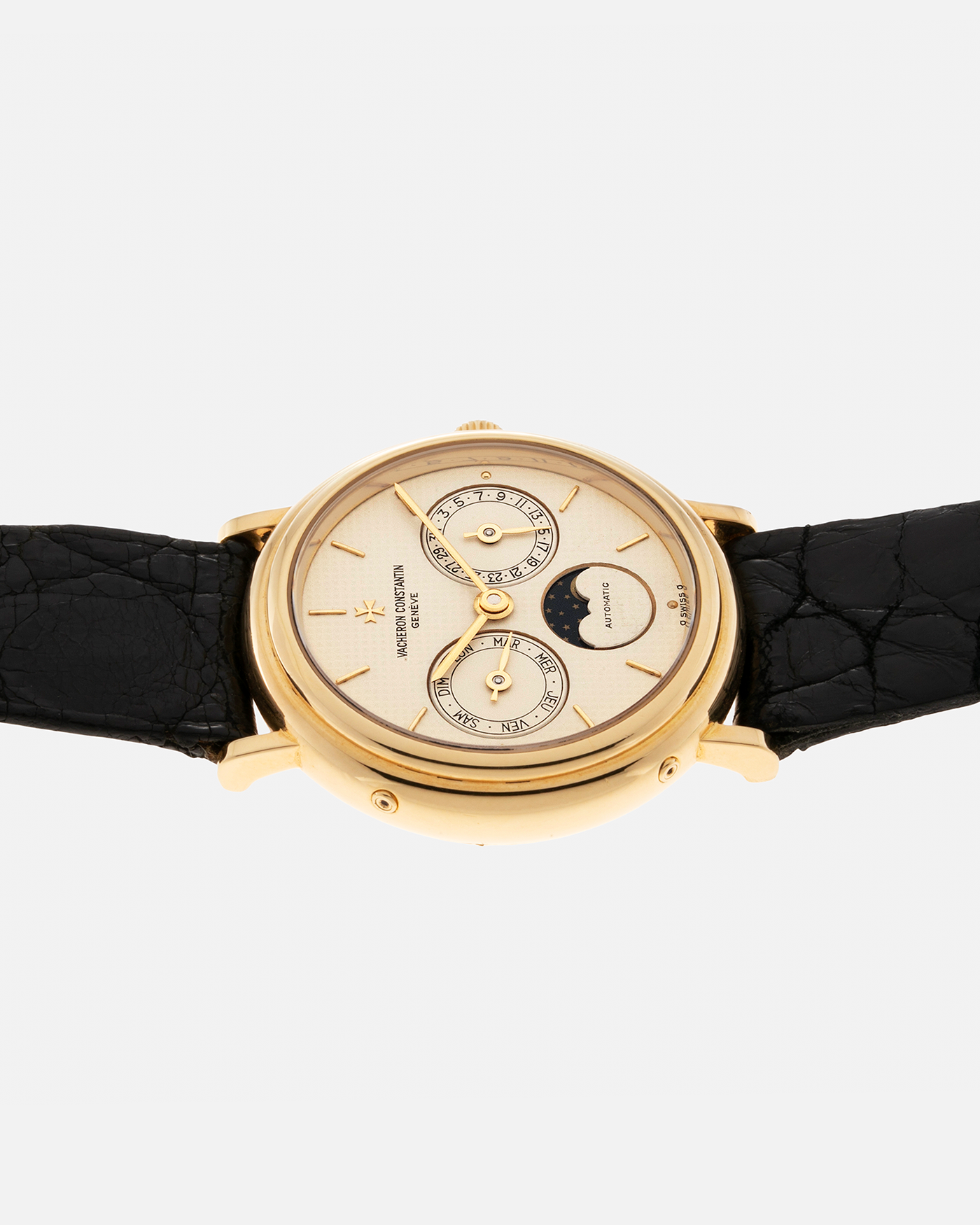 Brand: Vacheron Constantin Year: 1990’s Model: Day-Date Moonphase Reference Number: 46009 Material: 18-carat Yellow Gold Movement: Vacheron Constantin Cal. 1126 QS, Self-Winding Case Diameter: 34mm Bracelet: Vacheron Constantin Black Lizard Leather Strap with Signed 18-carat Yellow Gold Tang Buckle