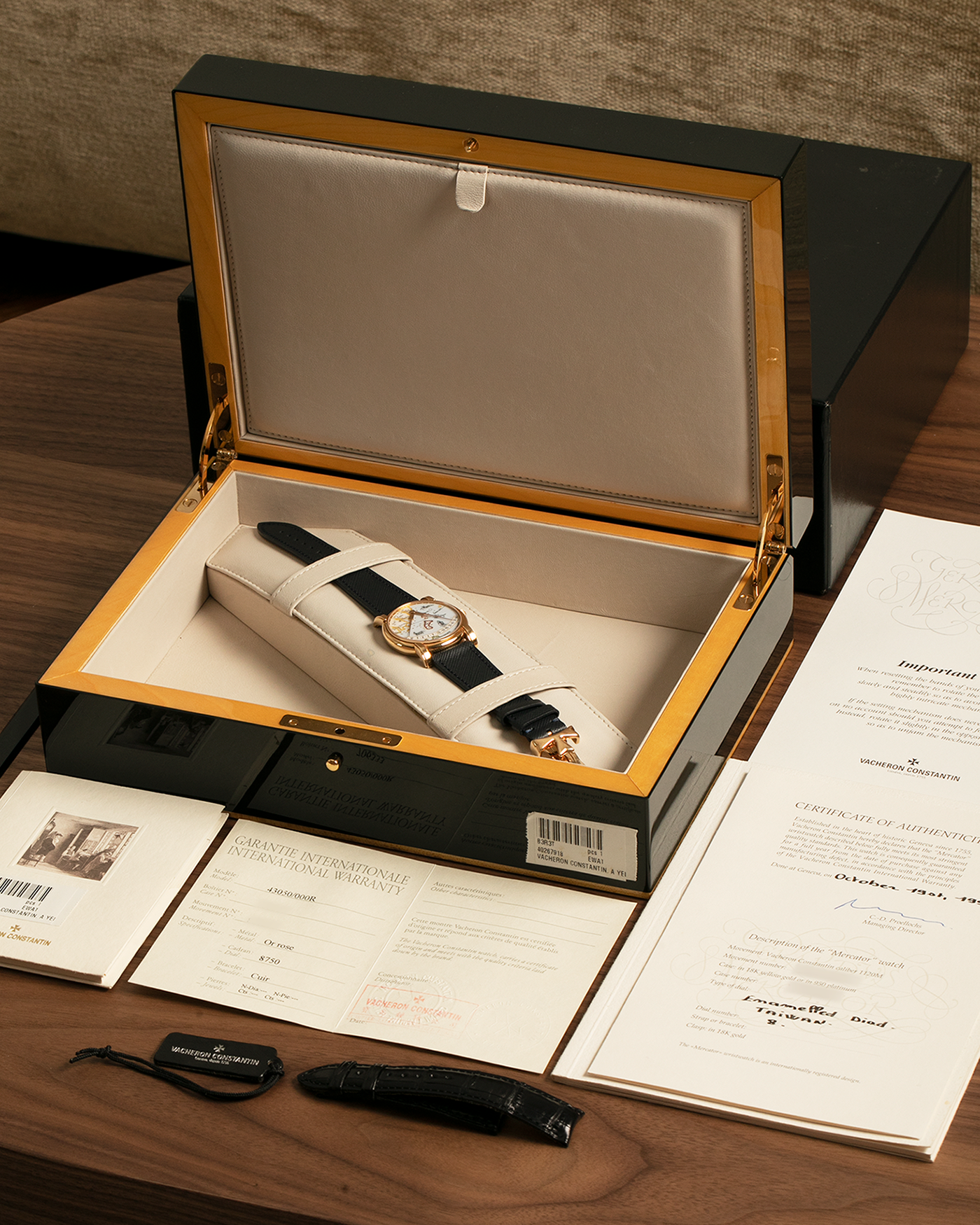 Brand: Vacheron Constantin
Year: 1998
Model: Mercator
Reference Number: 43050
Material: 18-carat Rose Gold Case, Champlevé Enamel Dial
Movement: Vacheron Constantin Cal. 1120/2 (Heavily-Modified Jaeger LeCoultre Cal. 920 Ébauche), Self-Winding
Case Dimensions: 36mm x 9mm (Lug-to-Lug 41mm)
Lug Width: 20mm
Strap: Molequin Dark Navy Textured Calf Leather Strap with Signed 18-carat Yellow Gold Deployant Buckle, extra Vacheron Constantin Black Alligator Leather Strap (Used)