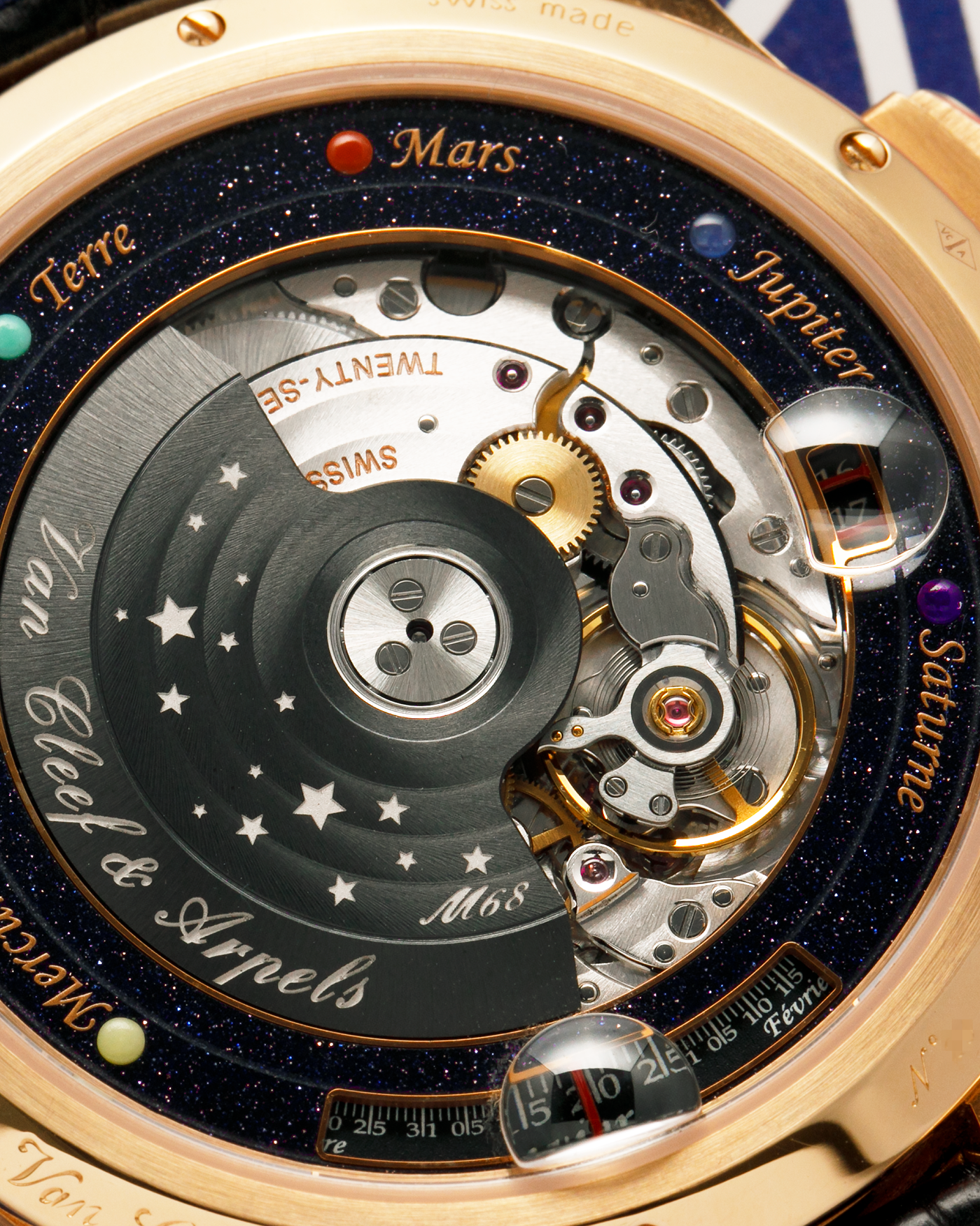 Brand: Van Cleef & Arpels
Year: 2015
Model: Midnight Planetarium
Reference Number: VCARO4J000
Material: 18k Rose Gold
Movement: Automatic Roger Dubuis-derived Stern Manufacture Base Calibre With an Exclusive Planetarium Module Developed By Christian Van Der Klaauw
Case Dimensions: 44mm Diameter 13.8mm Thickness
Strap: Van Cleef & Arpels Black Alligator Strap With Signed 18k Pink Gold Deployant Clasp