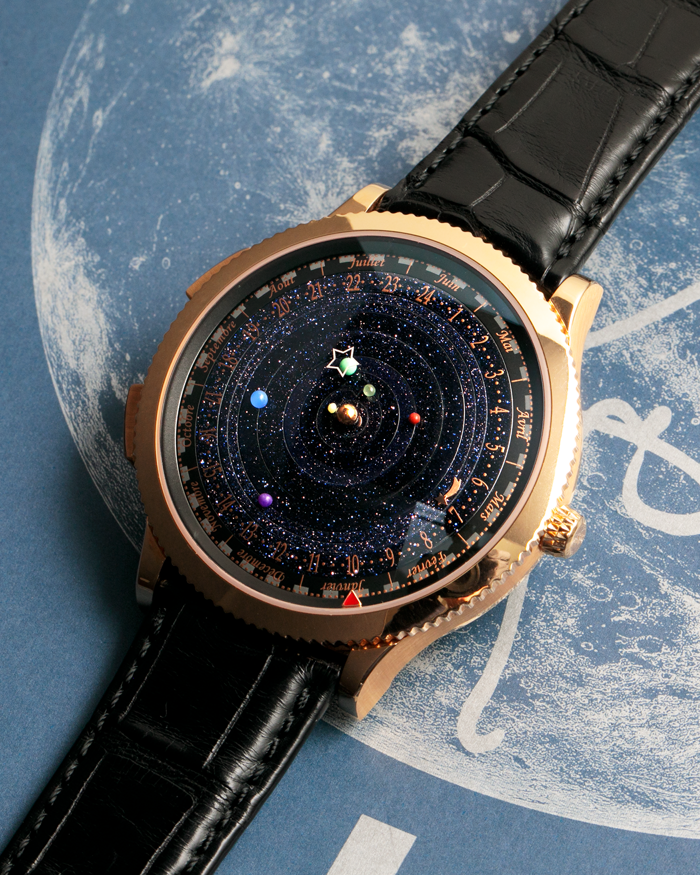 Brand: Van Cleef & Arpels
Year: 2015
Model: Midnight Planetarium
Reference Number: VCARO4J000
Material: 18k Rose Gold
Movement: Automatic Roger Dubuis-derived Stern Manufacture Base Calibre With an Exclusive Planetarium Module Developed By Christian Van Der Klaauw
Case Dimensions: 44mm Diameter 13.8mm Thickness
Strap: Van Cleef & Arpels Black Alligator Strap With Signed 18k Pink Gold Deployant Clasp