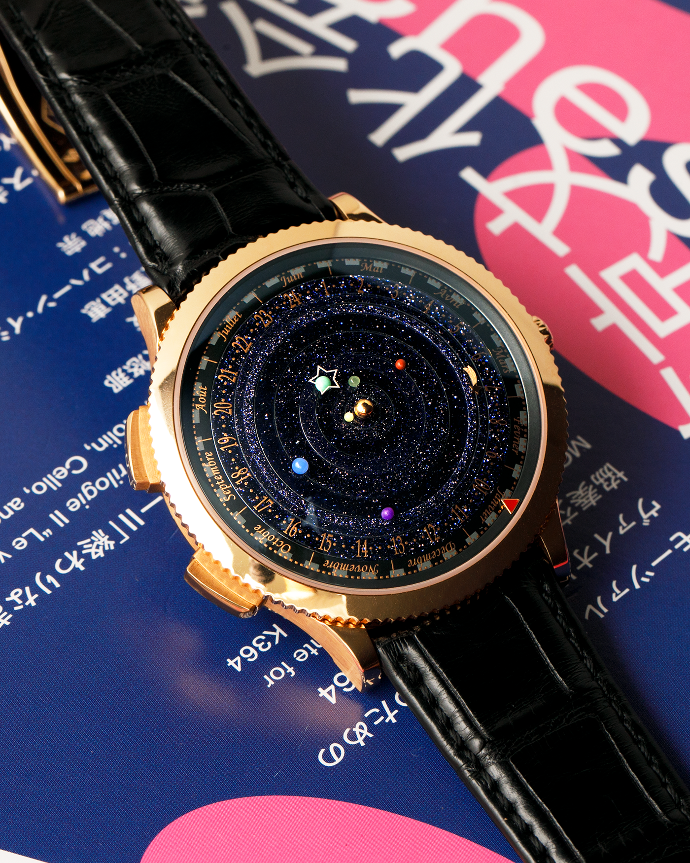 Brand: Van Cleef & Arpels
Year: 2015
Model: Midnight Planetarium
Reference Number: VCARO4J000
Material: 18k Rose Gold
Movement: Automatic Roger Dubuis-derived Stern Manufacture Base Calibre With an Exclusive Planetarium Module Developed By Christian Van Der Klaauw
Case Dimensions: 44mm Diameter 13.8mm Thickness
Strap: Van Cleef & Arpels Black Alligator Strap With Signed 18k Pink Gold Deployant Clasp