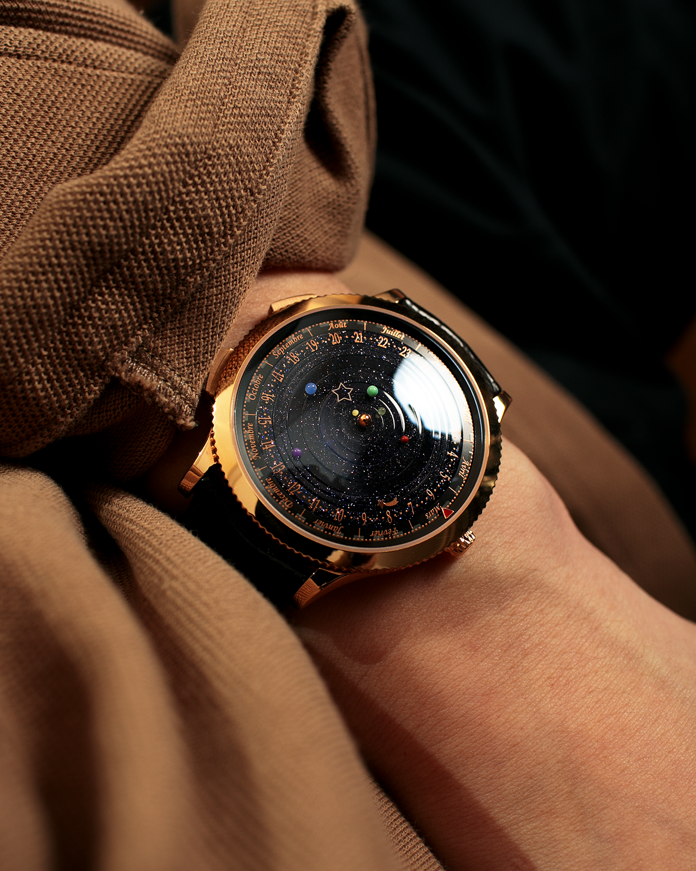 Brand: Van Cleef & Arpels
Year: 2015
Model: Midnight Planetarium
Reference Number: VCARO4J000
Material: 18k Rose Gold
Movement: Automatic Roger Dubuis-derived Stern Manufacture Base Calibre With an Exclusive Planetarium Module Developed By Christian Van Der Klaauw
Case Dimensions: 44mm Diameter 13.8mm Thickness
Strap: Van Cleef & Arpels Black Alligator Strap With Signed 18k Pink Gold Deployant Clasp