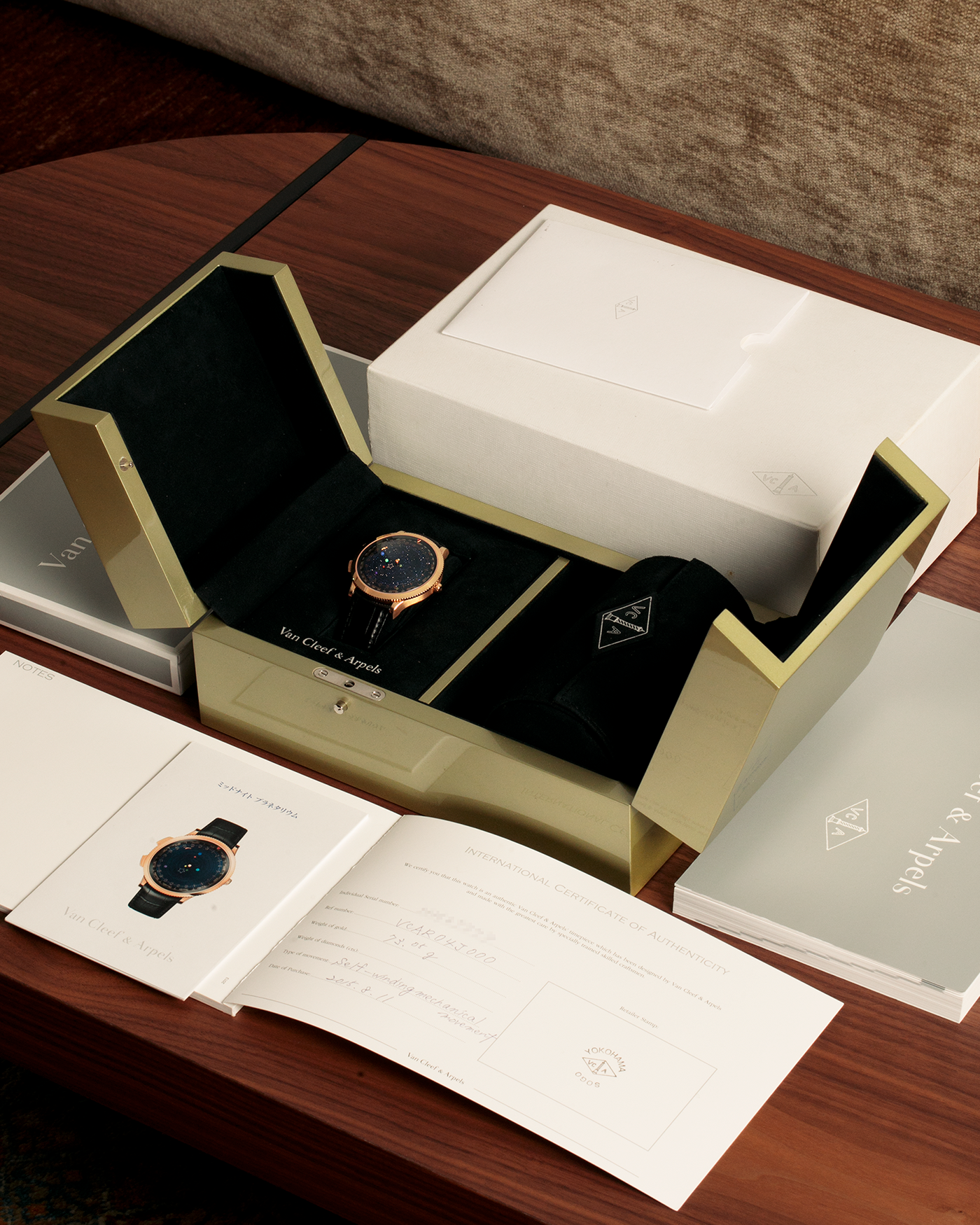 Brand: Van Cleef & Arpels
Year: 2015
Model: Midnight Planetarium
Reference Number: VCARO4J000
Material: 18k Rose Gold
Movement: Automatic Roger Dubuis-derived Stern Manufacture Base Calibre With an Exclusive Planetarium Module Developed By Christian Van Der Klaauw
Case Dimensions: 44mm Diameter 13.8mm Thickness
Strap: Van Cleef & Arpels Black Alligator Strap With Signed 18k Pink Gold Deployant Clasp