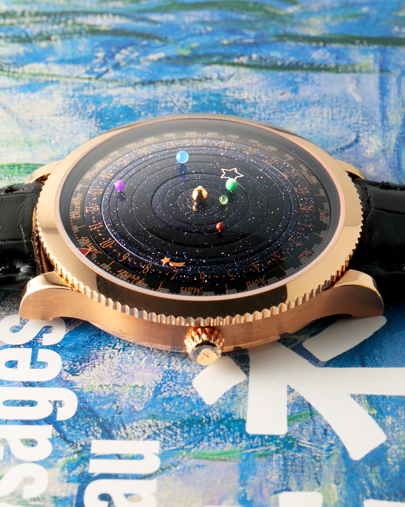 Brand: Van Cleef & Arpels
Year: 2015
Model: Midnight Planetarium
Reference Number: VCARO4J000
Material: 18k Rose Gold
Movement: Automatic Roger Dubuis-derived Stern Manufacture Base Calibre With an Exclusive Planetarium Module Developed By Christian Van Der Klaauw
Case Dimensions: 44mm Diameter 13.8mm Thickness
Strap: Van Cleef & Arpels Black Alligator Strap With Signed 18k Pink Gold Deployant Clasp