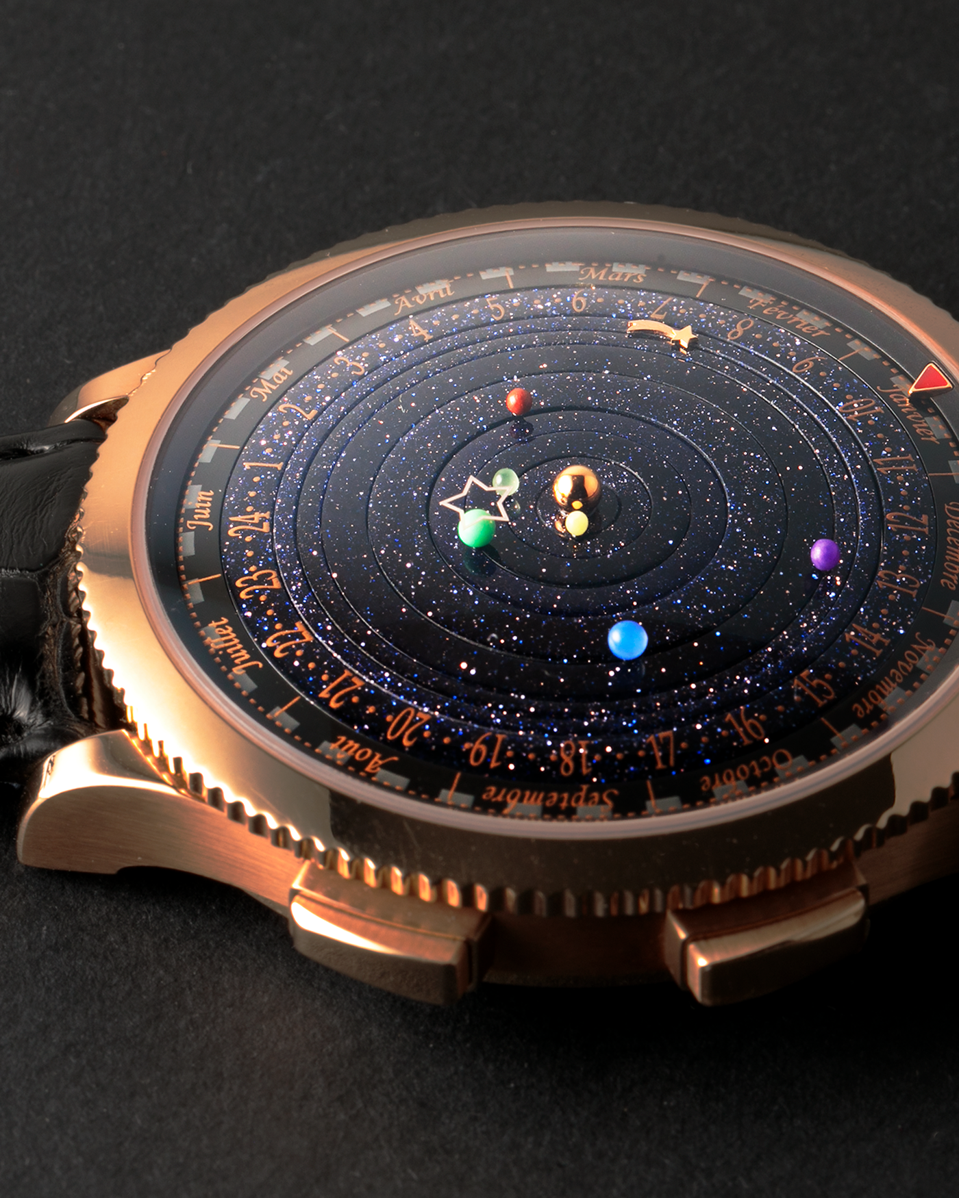 Brand: Van Cleef & Arpels
Year: 2015
Model: Midnight Planetarium
Reference Number: VCARO4J000
Material: 18k Rose Gold
Movement: Automatic Roger Dubuis-derived Stern Manufacture Base Calibre With an Exclusive Planetarium Module Developed By Christian Van Der Klaauw
Case Dimensions: 44mm Diameter 13.8mm Thickness
Strap: Van Cleef & Arpels Black Alligator Strap With Signed 18k Pink Gold Deployant Clasp