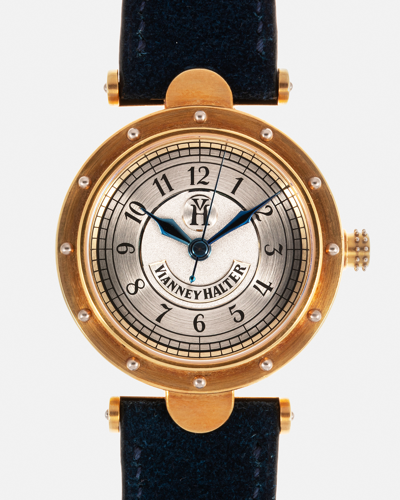 Brand: Vianney Halter Year: 2000’s Model: Classic Material: 18k Yellow Gold Movement: Modified Lemania 8810 with mystery motor Case Diameter: 36mm Bracelet/Strap: Blue Suede strap with Yellow Gold Tang Buckle