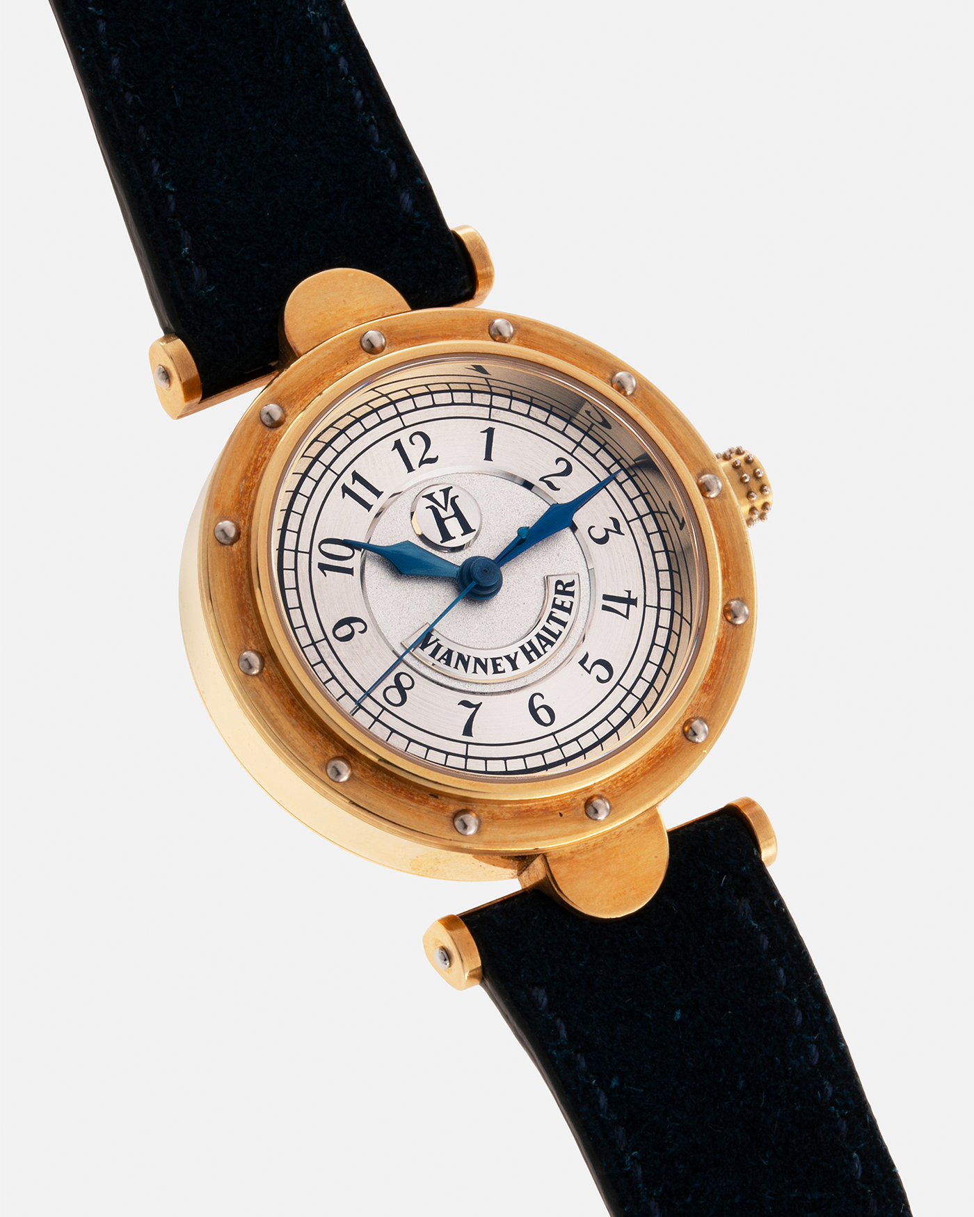 Brand: Vianney Halter Year: 2000’s Model: Classic Material: 18k Yellow Gold Movement: Modified Lemania 8810 with mystery motor Case Diameter: 36mm Bracelet/Strap: Blue Suede strap with Yellow Gold Tang Buckle