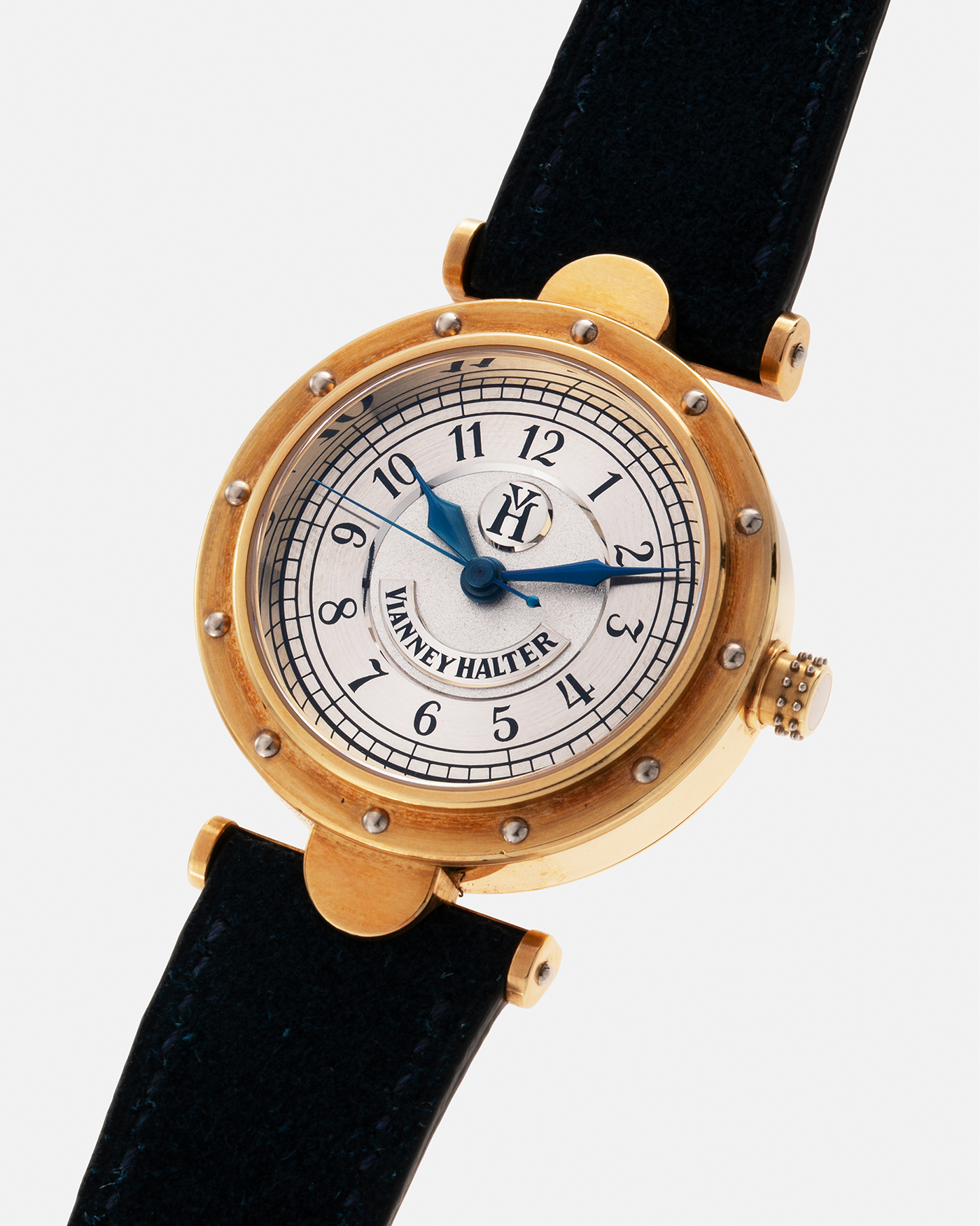 Brand: Vianney Halter Year: 2000’s Model: Classic Material: 18k Yellow Gold Movement: Modified Lemania 8810 with mystery motor Case Diameter: 36mm Bracelet/Strap: Blue Suede strap with Yellow Gold Tang Buckle