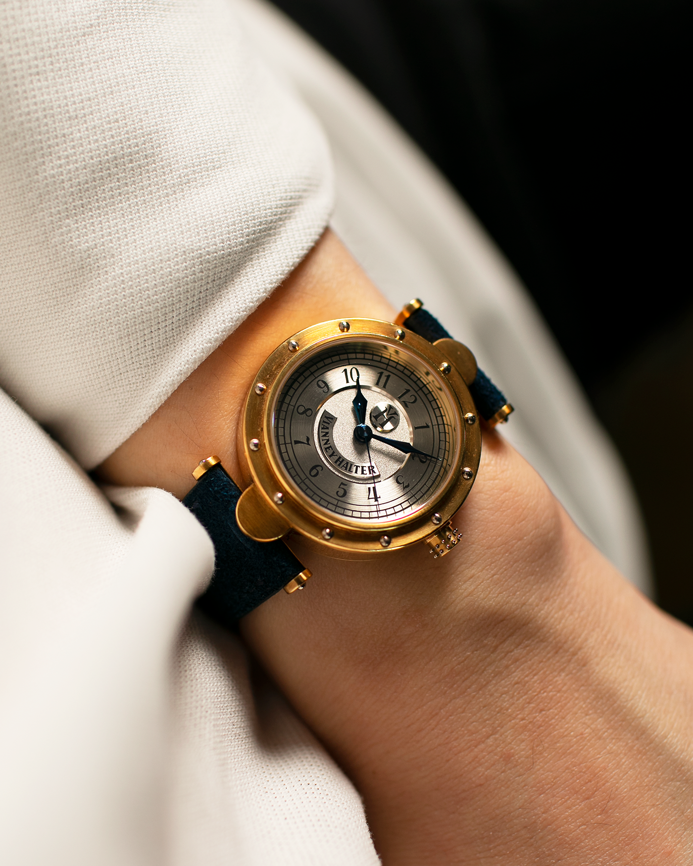 Brand: Vianney Halter Year: 2000’s Model: Classic Material: 18k Yellow Gold Movement: Modified Lemania 8810 with mystery motor Case Diameter: 36mm Bracelet/Strap: Blue Suede strap with Yellow Gold Tang Buckle