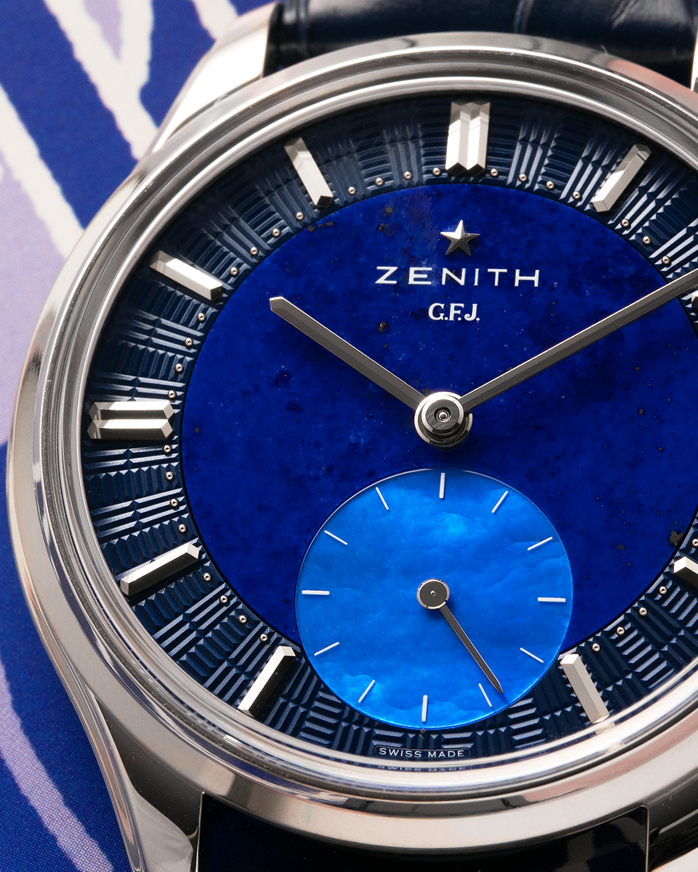 Brand: Zenith
Year: 2026
Model: G.F.J.
Reference Number: 40.1865.0135/51.C200
Material: Platinum 950
Movement: Caliber 135
Case Diameter: 39.15mm Diameter 10.5mm Thickness
Strap: Zenith Blue Alligator Strap with Platinum Zenith Tang Buckle