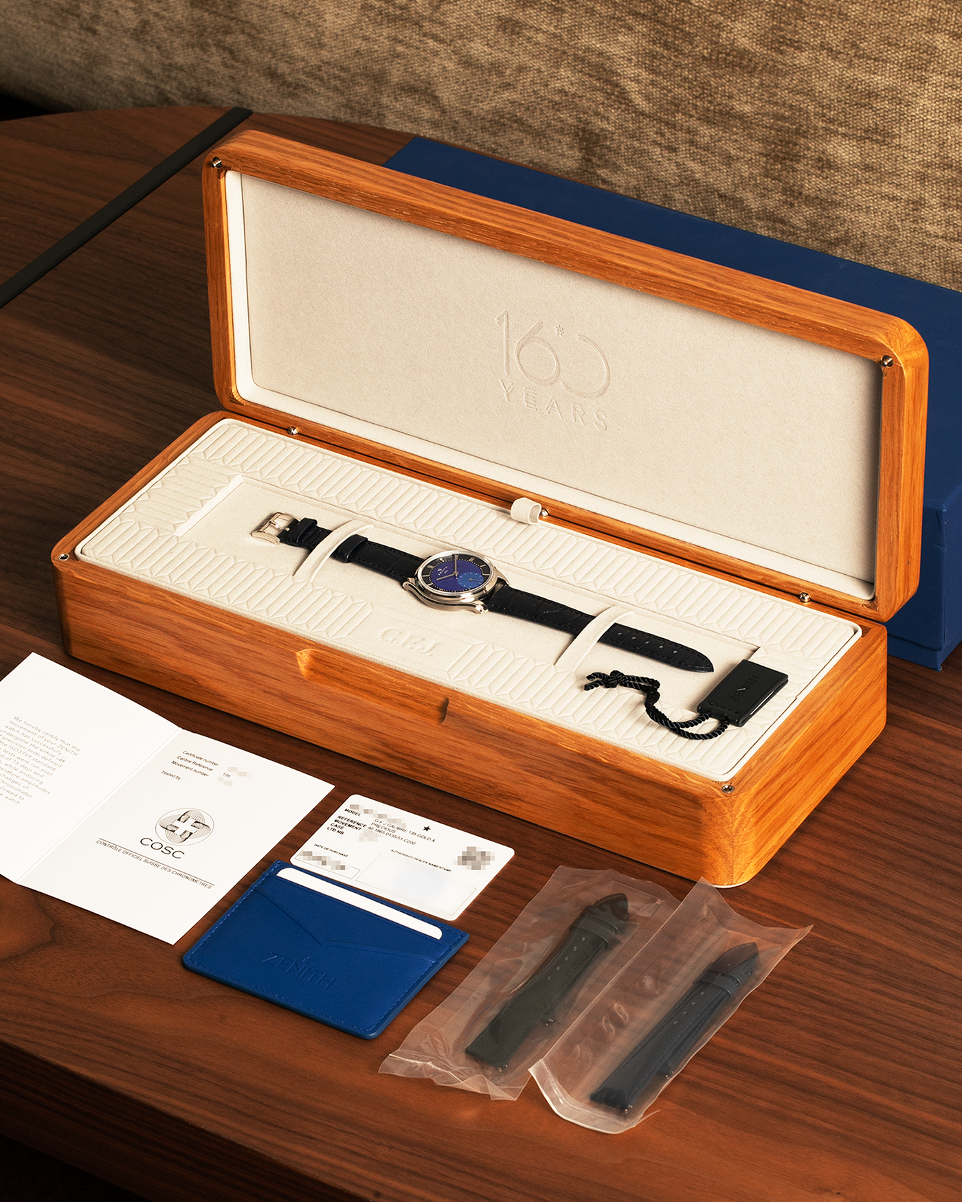 Brand: Zenith
Year: 2026
Model: G.F.J.
Reference Number: 40.1865.0135/51.C200
Material: Platinum 950
Movement: Caliber 135
Case Diameter: 39.15mm Diameter 10.5mm Thickness
Strap: Zenith Blue Alligator Strap with Platinum Zenith Tang Buckle