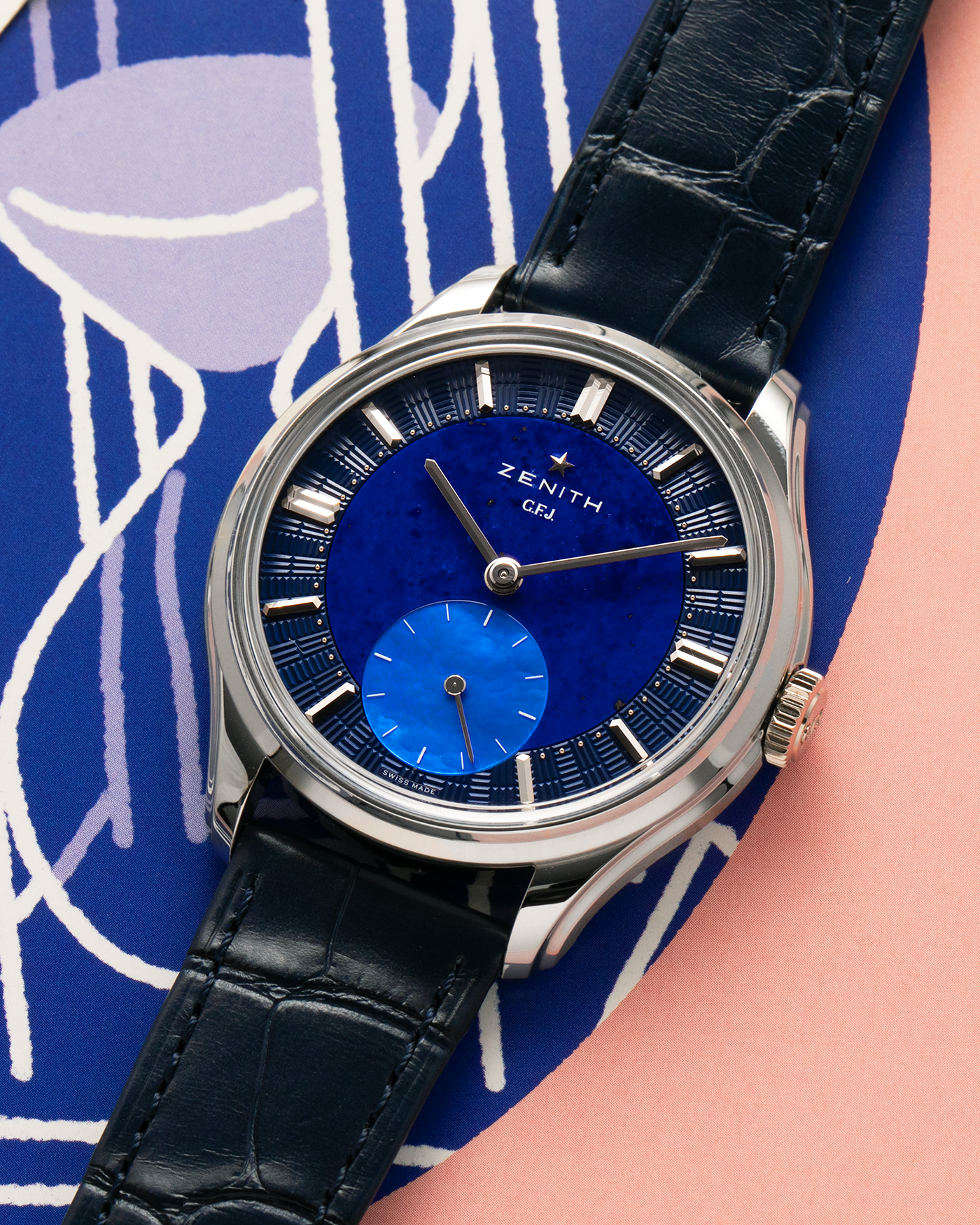 Brand: Zenith
Year: 2026
Model: G.F.J.
Reference Number: 40.1865.0135/51.C200
Material: Platinum 950
Movement: Caliber 135
Case Diameter: 39.15mm Diameter 10.5mm Thickness
Strap: Zenith Blue Alligator Strap with Platinum Zenith Tang Buckle