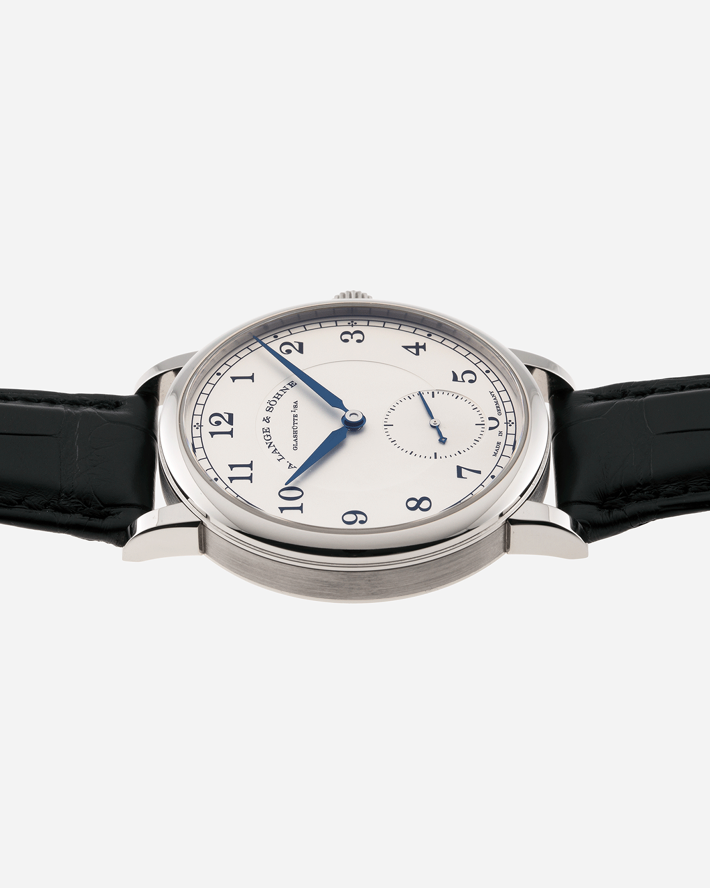 Brand: A. Lange & Sohne Year: 2010’s Model: 1815 Annual Calendar Ref Number: 235.026 Material: 18k White Gold Movement: Manual Winding In-House Cal. L051.1 Case Diameter: 38mm Bracelet/Strap: A. Lange & Sohne Black Alligator Strap with signed 18k White Gold Tang Buckle