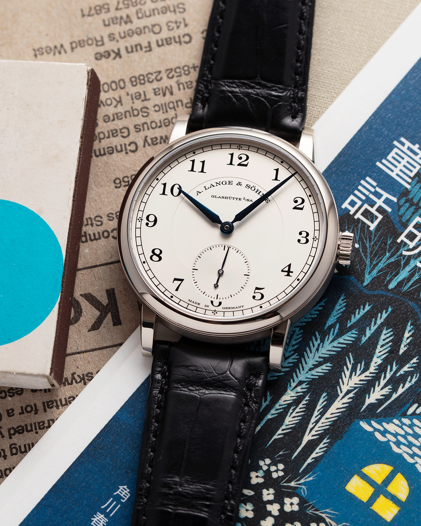 Brand: A. Lange & Sohne Year: 2010’s Model: 1815 Annual Calendar Ref Number: 235.026 Material: 18k White Gold Movement: Manual Winding In-House Cal. L051.1 Case Diameter: 38mm Bracelet/Strap: A. Lange & Sohne Black Alligator Strap with signed 18k White Gold Tang Buckle
