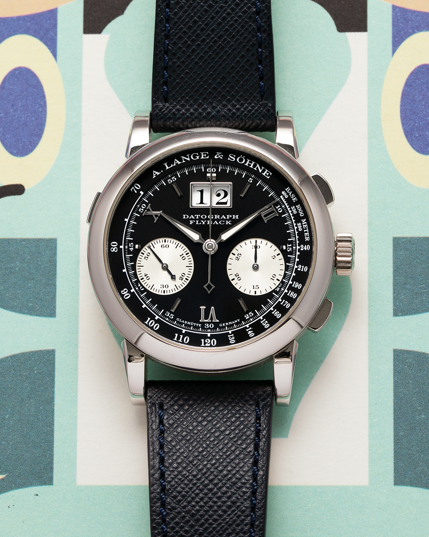 Brand: A. Lange & Sohne Year: 2000’s Model: Datograph Reference Number: 403.035 Material: Platinum Movement: Manual Winding L951.1 Case Diameter: 39mm Bracelet/Strap: Molequin Navy Textured Calf and A. Lange & Sohne Platinum Tang Buckle