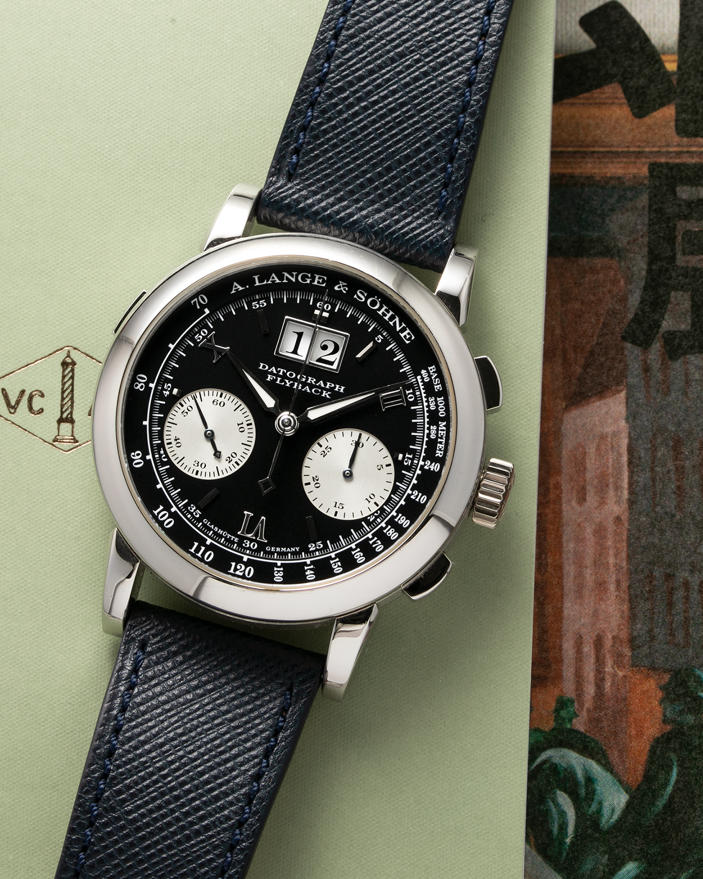 Brand: A. Lange & Sohne Year: 2000’s Model: Datograph Reference Number: 403.035 Material: Platinum Movement: Manual Winding L951.1 Case Diameter: 39mm Bracelet/Strap: Molequin Navy Textured Calf and A. Lange & Sohne Platinum Tang Buckle