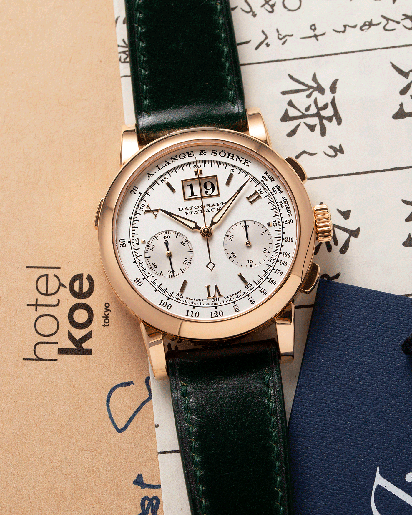 Brand: A. Lange & Sohne Year: 2009 Model: Datograph Reference Number: 403.032 Material: 18k Rose Gold Movement: Manual Winding L951.1 Case Diameter: 39mm Bracelet/Strap: Delugs Green Leather Strap with signed 18k Rose Gold Tang Buckle