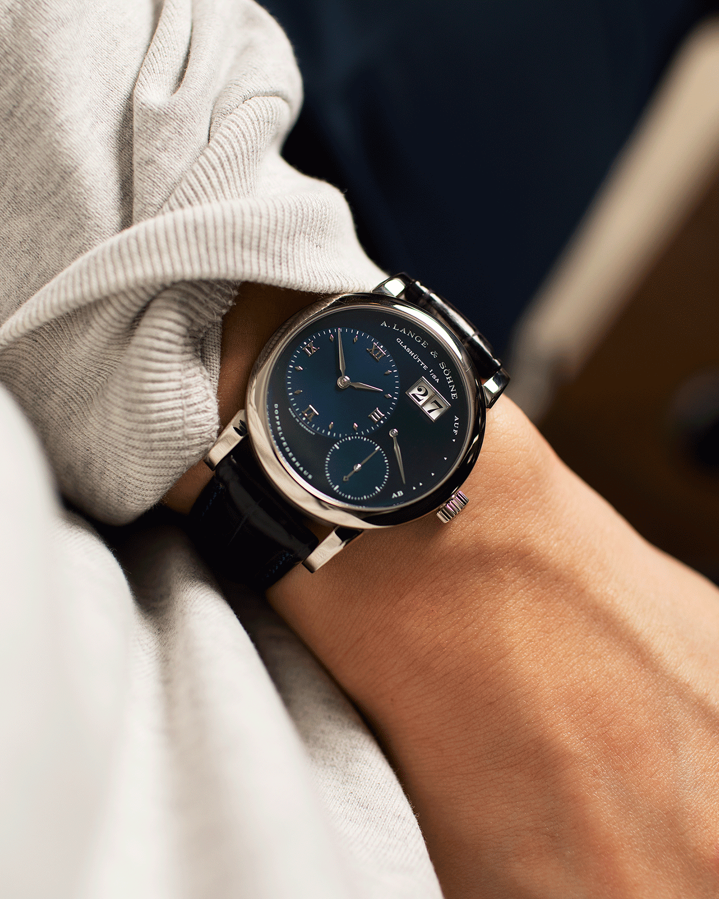 Brand: A. Lange & Sohne Year: 2000’s Model: Lange 1 Reference Number: 101.027 Material: 18k White Gold Movement: Manual Winding L901.5 Case Diameter: 38.5mm Bracelet/Strap: Blue Alligator Strap with 18k White Gold A. Lange & Sohne Tang Buckle