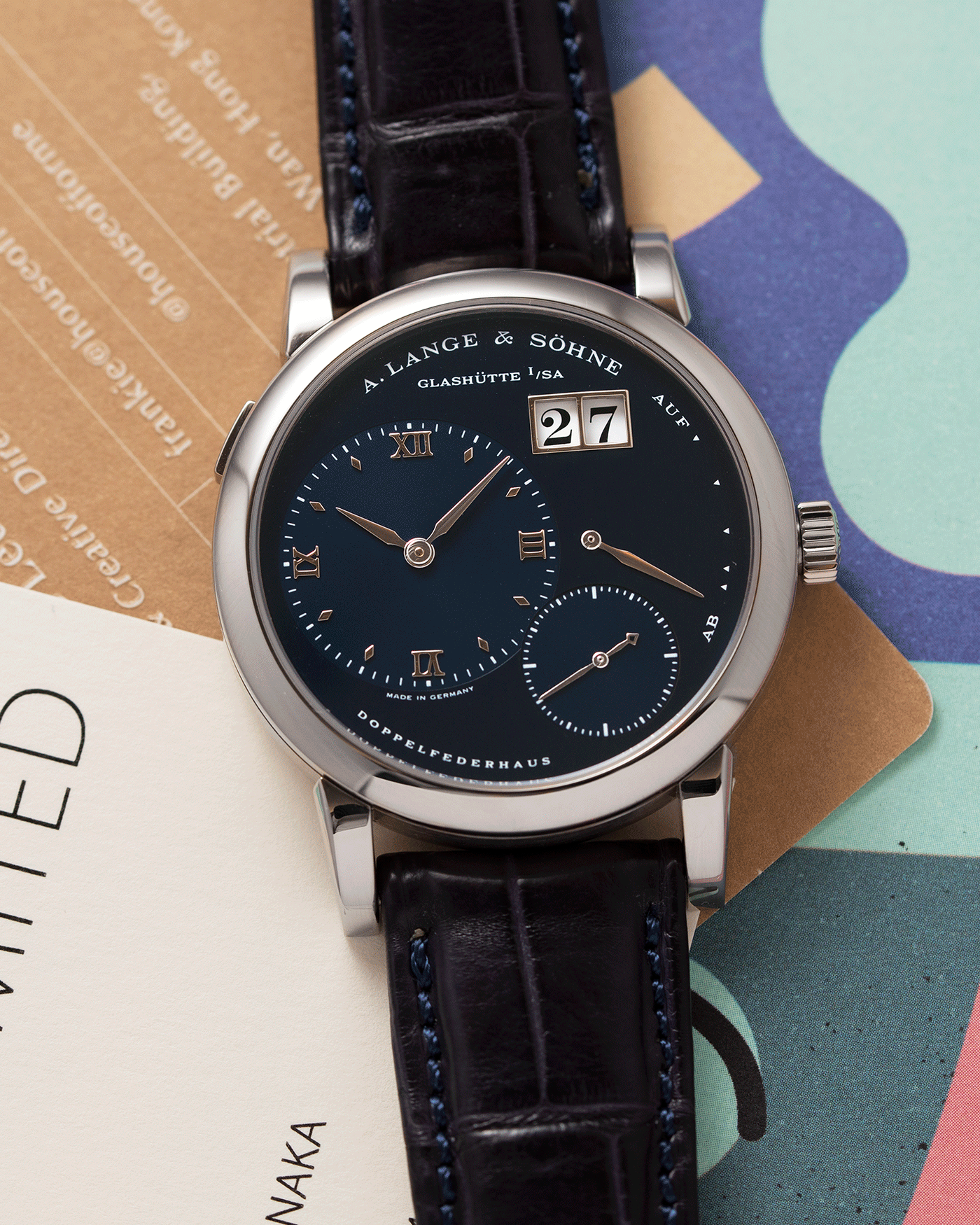 Brand: A. Lange & Sohne Year: 2000’s Model: Lange 1 Reference Number: 101.027 Material: 18k White Gold Movement: Manual Winding L901.5 Case Diameter: 38.5mm Bracelet/Strap: Blue Alligator Strap with 18k White Gold A. Lange & Sohne Tang Buckle