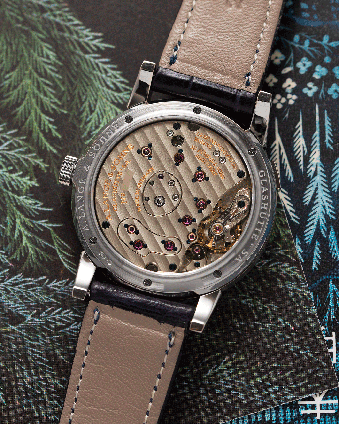 Brand: A. Lange & Sohne Year: 2000’s Model: Lange 1 Reference Number: 101.027 Material: 18k White Gold Movement: Manual Winding L901.5 Case Diameter: 38.5mm Bracelet/Strap: Blue Alligator Strap with 18k White Gold A. Lange & Sohne Tang Buckle