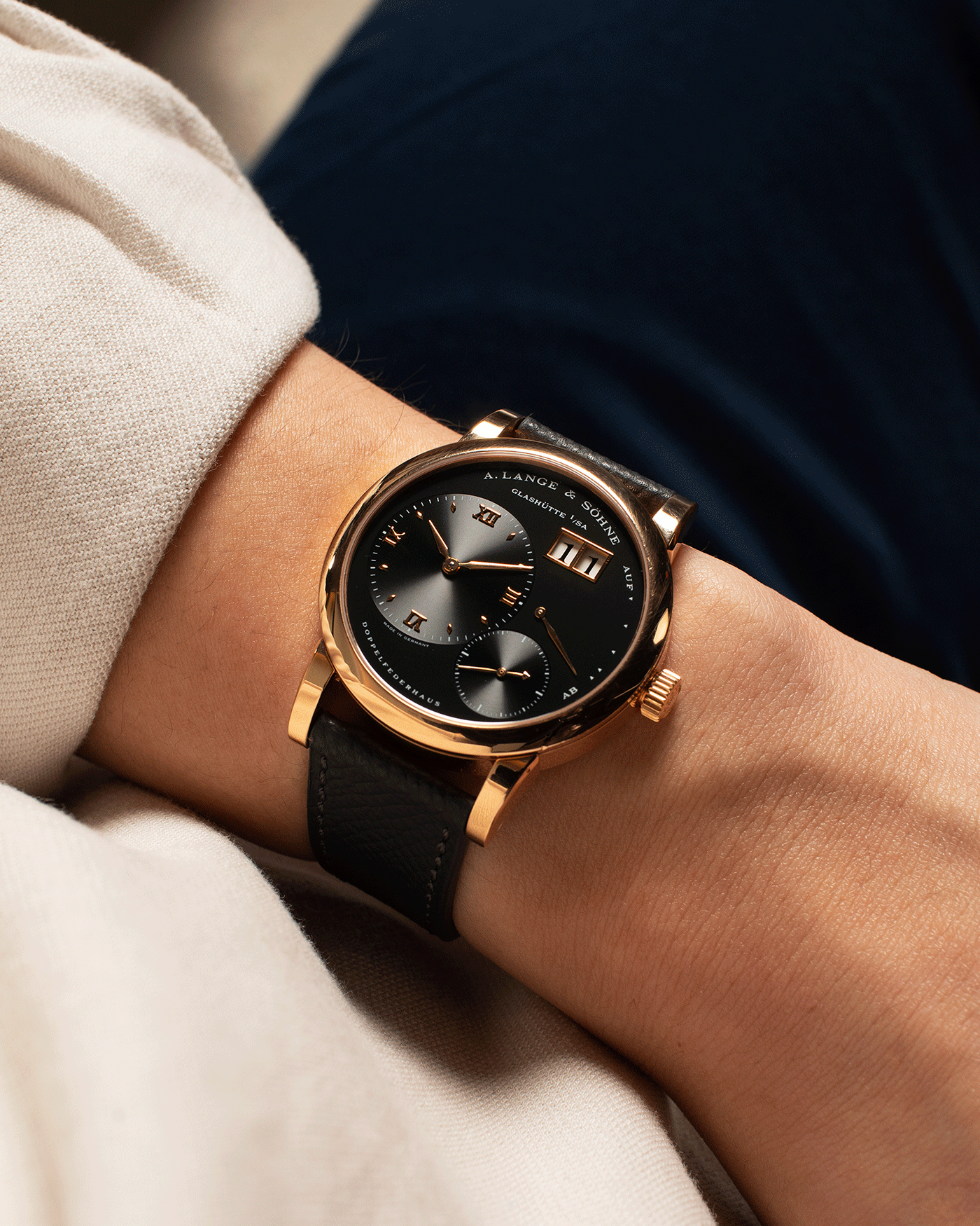 Brand: A. Lange & Sohne Year: 2004 Model: Lange 1 Reference Number: 101.031 Material: 18k Rose Gold Movement: Manual Winding L901.5 Case Diameter: 38.5mm Bracelet/Strap: Nostime Anthracite Textured Calf with 18k Rose Gold Tang Buckle