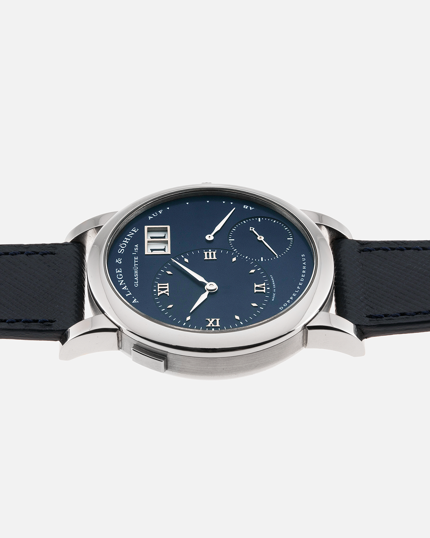 Brand: A. Lange & Sohne Year: 2000’s Model: Lange 1  Reference Number: 101.027 Material: 18k White Gold Movement: Manual Winding L901.5 Case Diameter: 38.5mm Bracelet/Strap: Molequin Navy Blue Textured Calf with 18k White Gold A. Lange & Sohne Tang Buckle