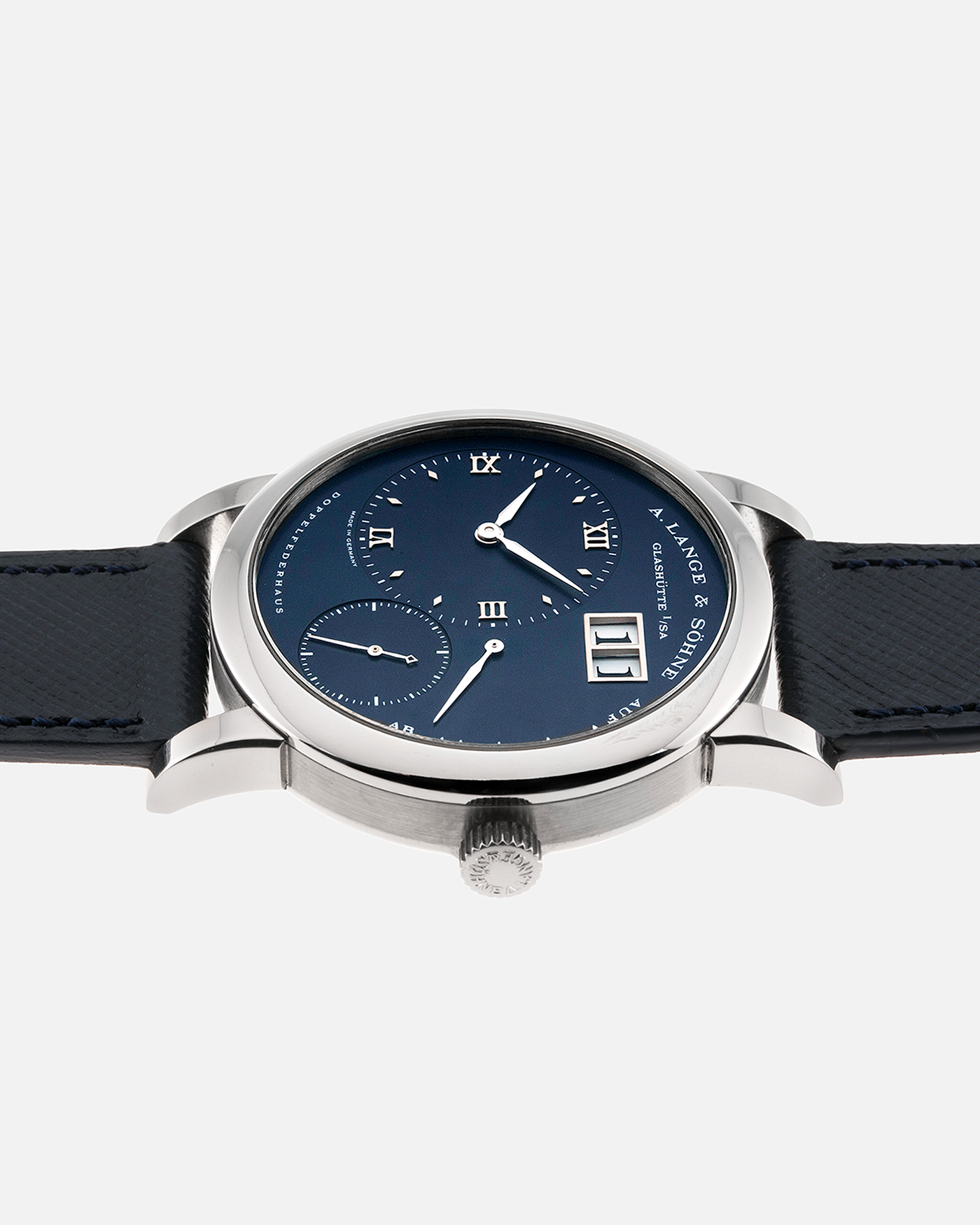 Brand: A. Lange & Sohne Year: 2000’s Model: Lange 1  Reference Number: 101.027 Material: 18k White Gold Movement: Manual Winding L901.5 Case Diameter: 38.5mm Bracelet/Strap: Molequin Navy Blue Textured Calf with 18k White Gold A. Lange & Sohne Tang Buckle