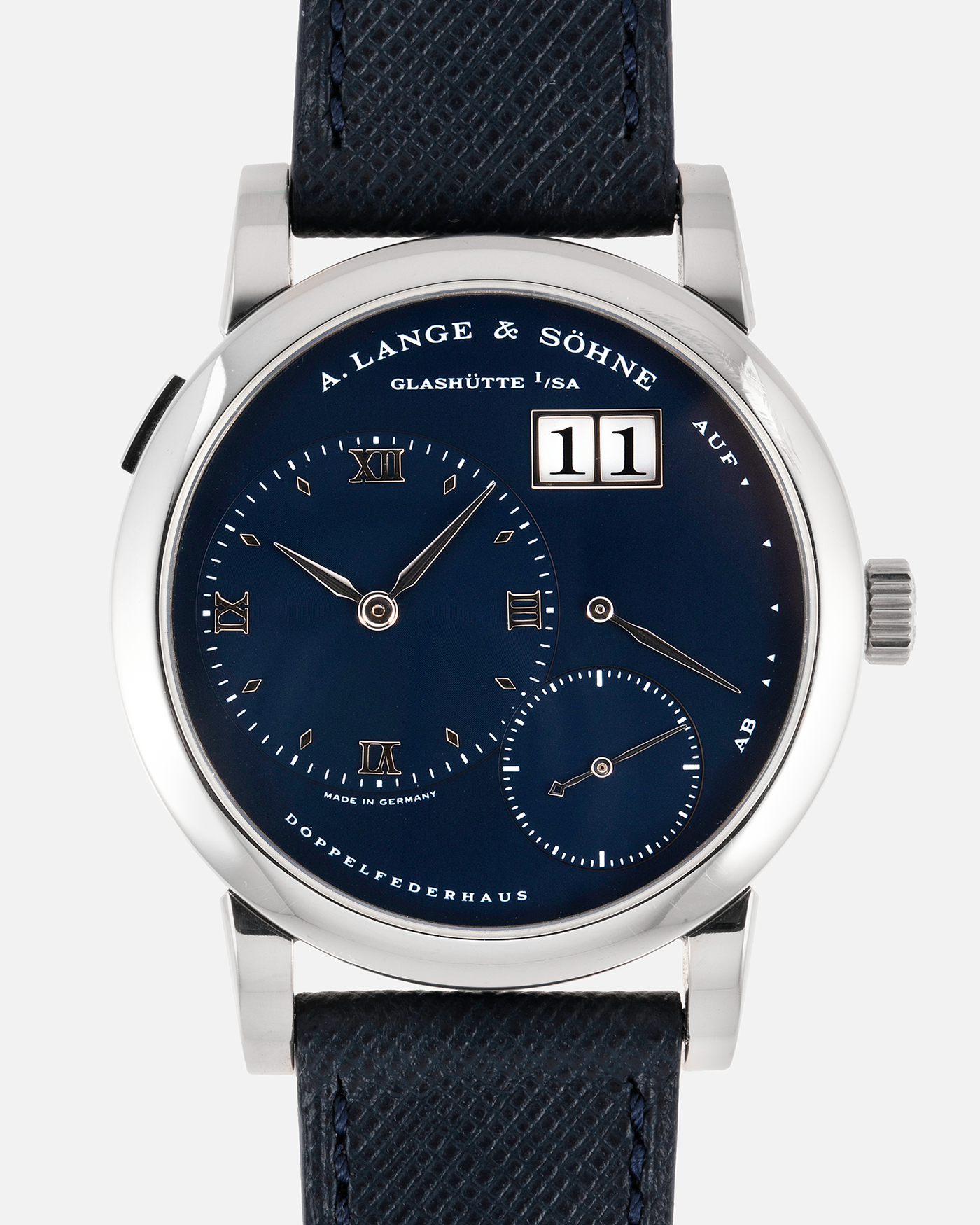 Brand: A. Lange & Sohne Year: 2000’s Model: Lange 1  Reference Number: 101.027 Material: 18k White Gold Movement: Manual Winding L901.5 Case Diameter: 38.5mm Bracelet/Strap: Molequin Navy Blue Textured Calf with 18k White Gold A. Lange & Sohne Tang Buckle