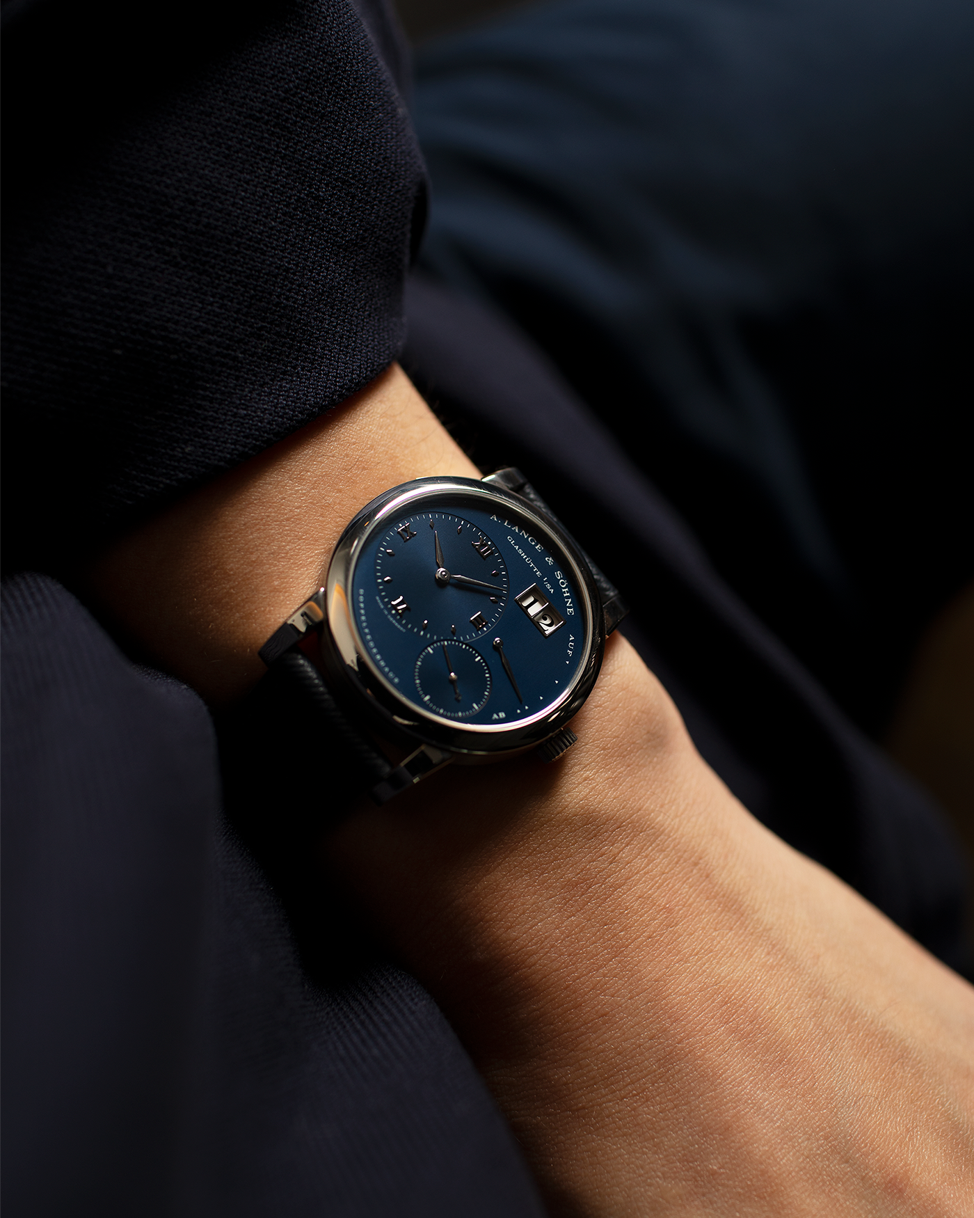 Brand: A. Lange & Sohne Year: 2000’s Model: Lange 1  Reference Number: 101.027 Material: 18k White Gold Movement: Manual Winding L901.5 Case Diameter: 38.5mm Bracelet/Strap: Molequin Navy Blue Textured Calf with 18k White Gold A. Lange & Sohne Tang Buckle