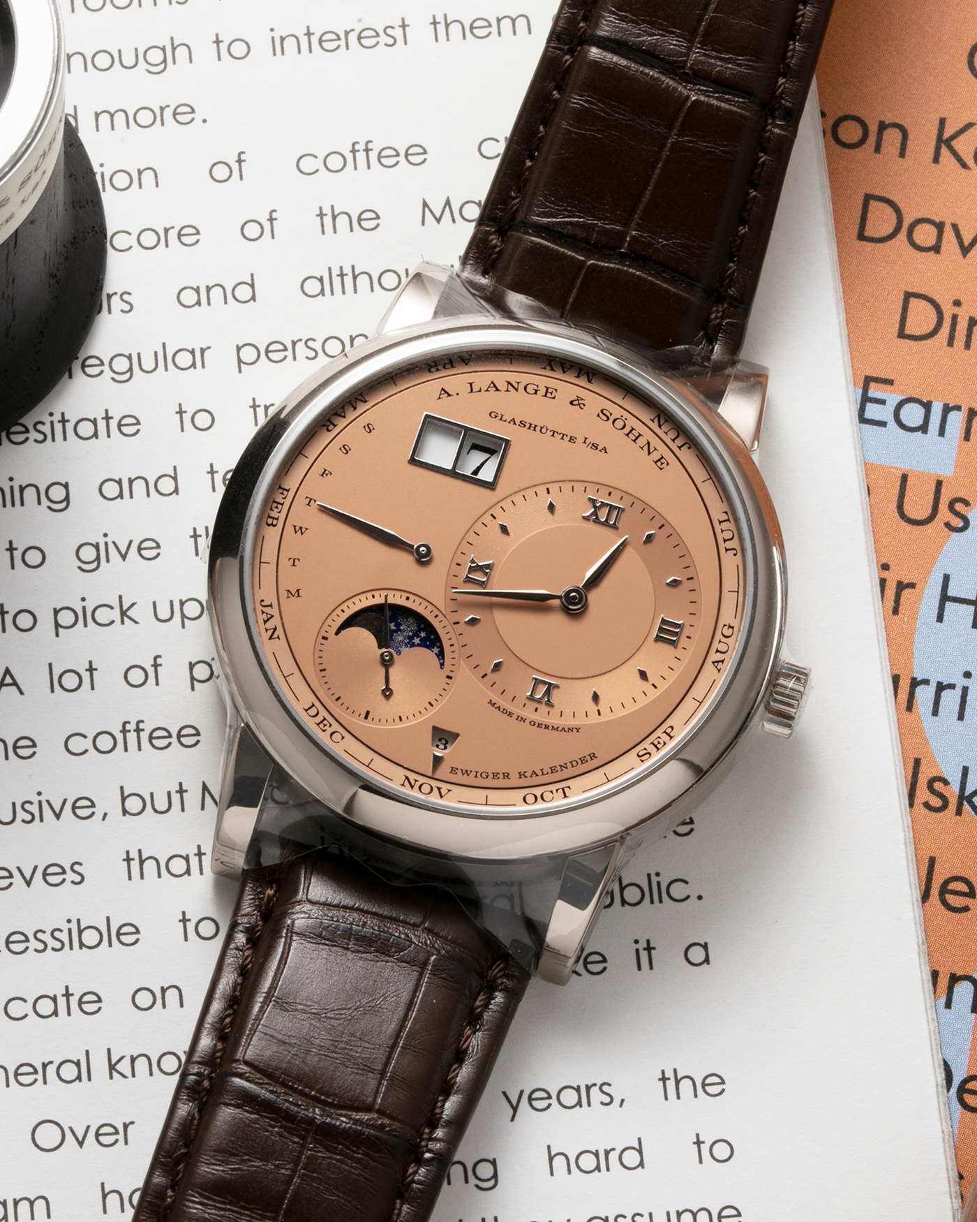 Brand: A. Lange & Söhne Year: 2021 Model: Lange 1 Reference Number: 345.056 Material: 18-carat White Gold Case, 18-carat Pink Gold Dial Movement: Cal. L021.3, Self-Winding Case Diameter: 41.9mm Bracelet/Strap: A. Lange & Söhne Dark Brown Alligator Strap with 18-carat White Gold Tang Buckle 