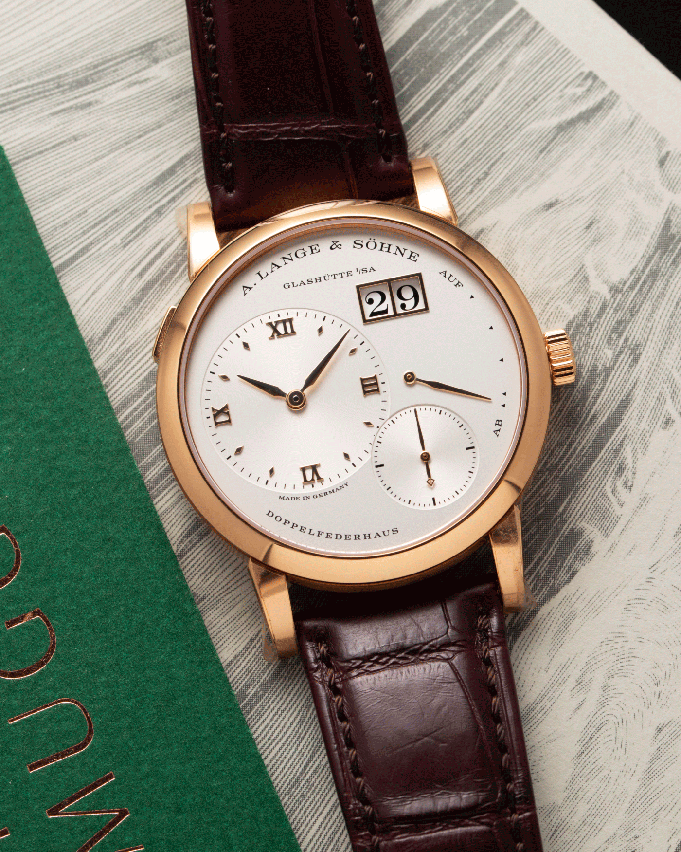 Brand: A. Lange & Sohne Year: 2021 Model: Lange 1 Reference Number: 191.032 Material: 18k Rose Gold Movement: Manual Winding L121.1 Case Diameter: 38.5mm Bracelet/Strap: Chestnut Brown Alligator Strap with 18k Rose Gold A. Lange & Sohne Tang Buckle