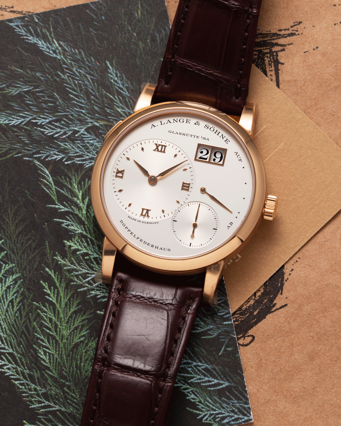 Brand: A. Lange & Sohne Year: 2021 Model: Lange 1 Reference Number: 191.032 Material: 18k Rose Gold Movement: Manual Winding L121.1 Case Diameter: 38.5mm Bracelet/Strap: Chestnut Brown Alligator Strap with 18k Rose Gold A. Lange & Sohne Tang Buckle