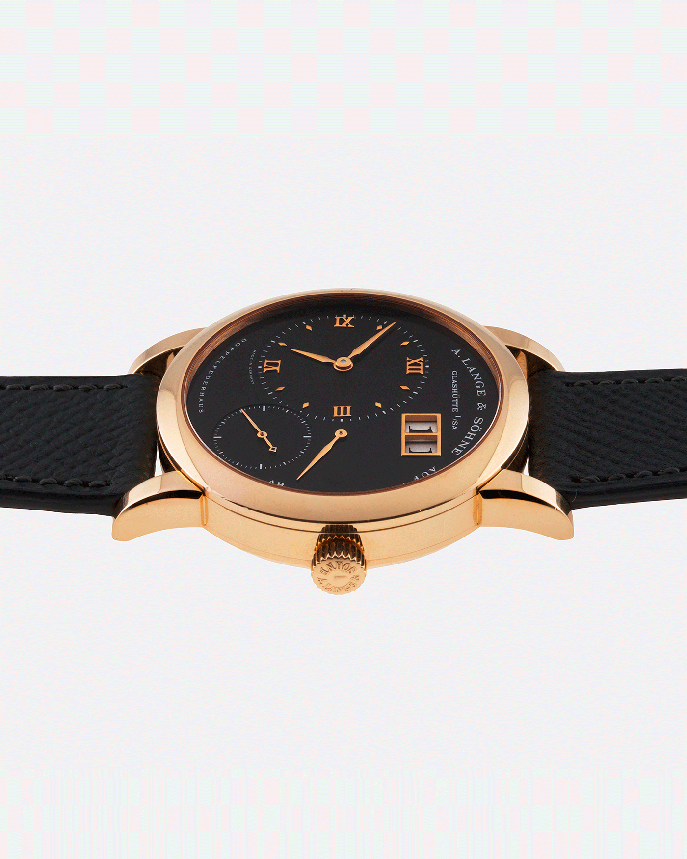 Brand: A. Lange & Sohne Year: 2004 Model: Lange 1 Reference Number: 101.031 Material: 18k Rose Gold Movement: Manual Winding L901.5 Case Diameter: 38.5mm Bracelet/Strap: Nostime Anthracite Textured Calf with 18k Rose Gold Tang Buckle