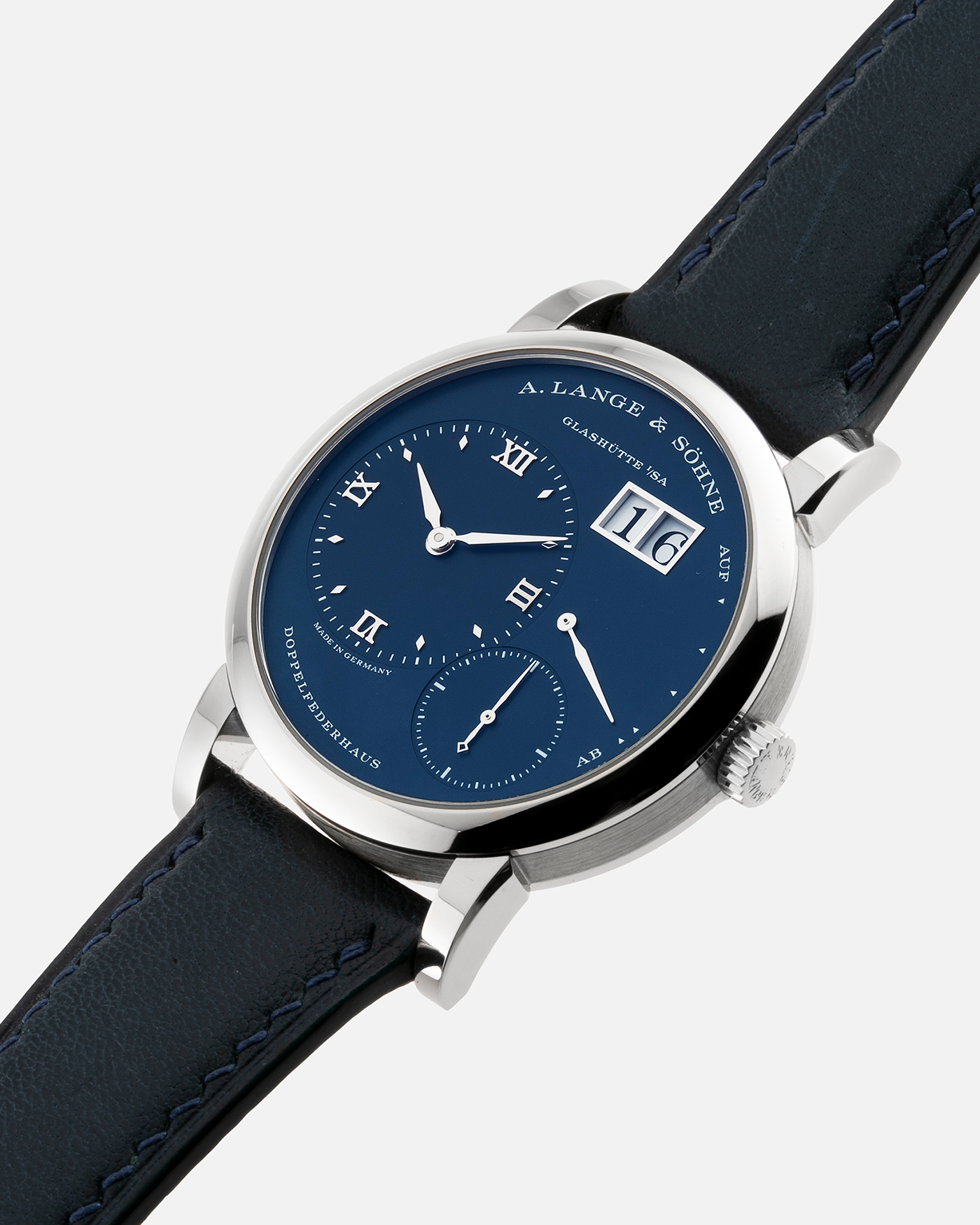 Brand: A. Lange & Söhne Year: 2017 Model: Lange 1 Reference Number: 191.028 Material: 18-carat White Gold Movement: Cal. L121.1, Manual-Winding Case Diameter: 38.5mm Bracelet/Strap: Dark Blue Calf Strap and A. Lange & Söhne Dark Blue Alligator Leather with Signed Tang Buckle 